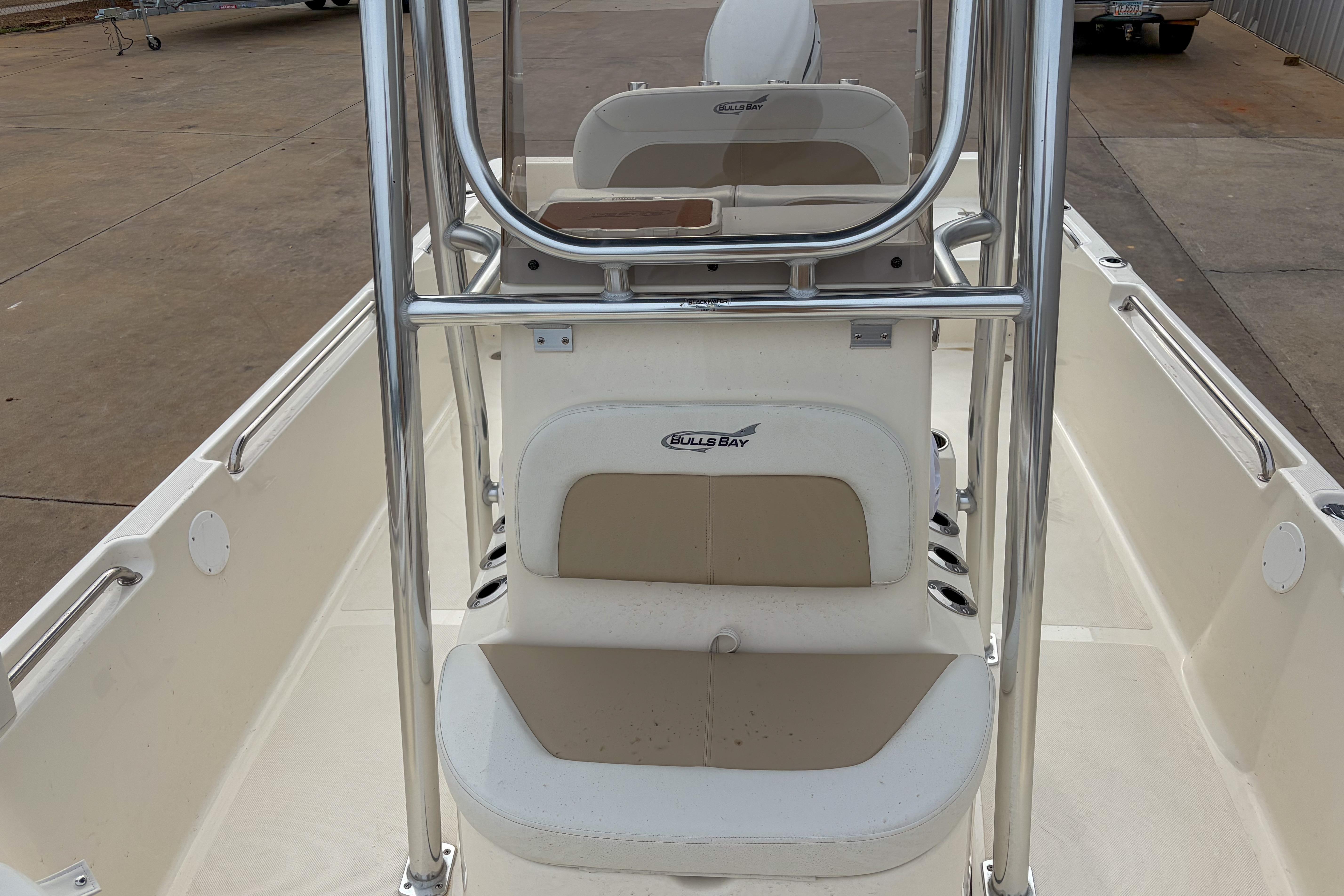 2026 Bulls Bay 2400 boat interior with seating and console, showcasing sleek design.
