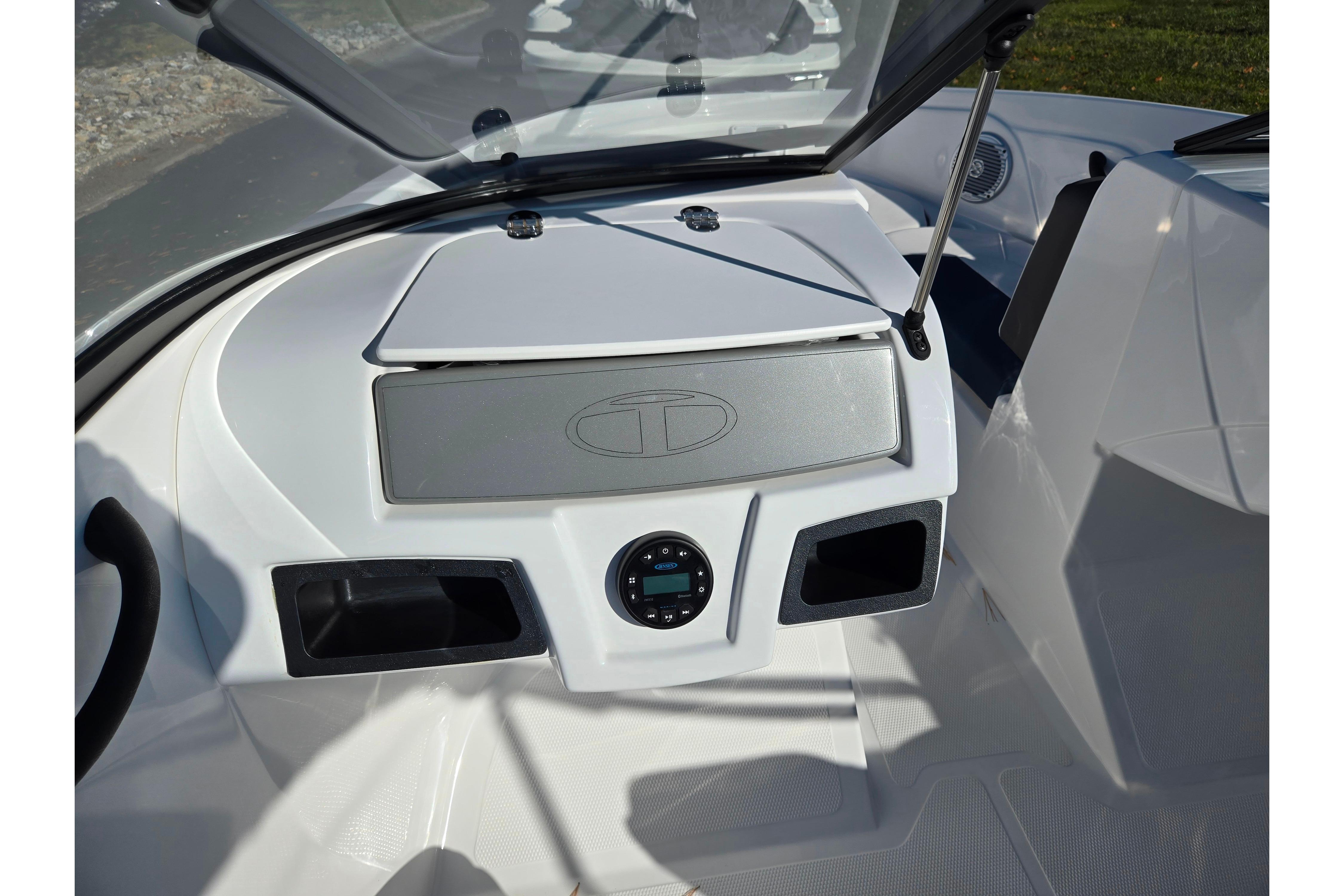2023 Tahoe 185 S boat dashboard with storage compartments and control panel.