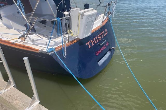 Sailboat "Thistle" docked, Tartan 3700 model, 2001, Galesville, MD.