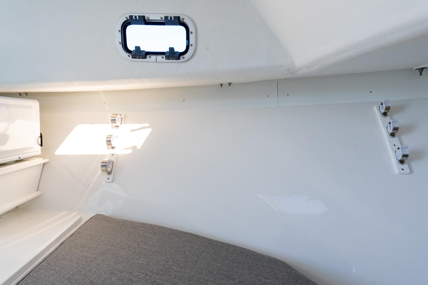 2024 Steiger Craft 31 Fisherman cabin interior with window and storage.