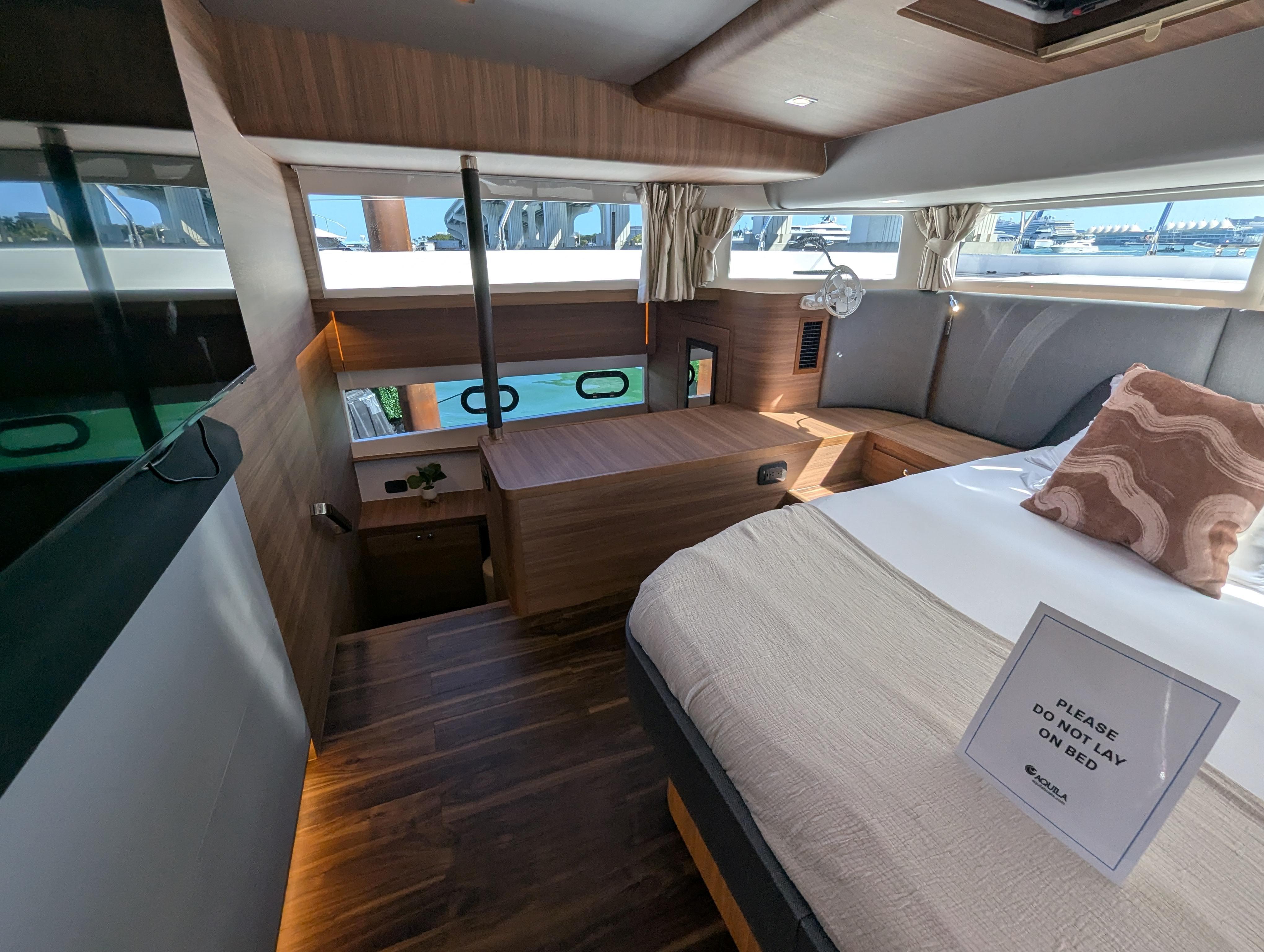 Luxurious interior of 2025 Aquila 54 Yacht with elegant wood finishes and modern design.