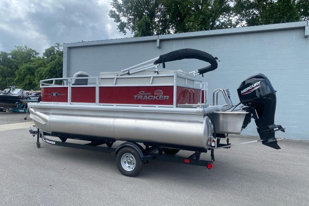 2026 Sun Tracker Bass Buggy 16 XL Select pontoon boat with Mercury outboard motor.