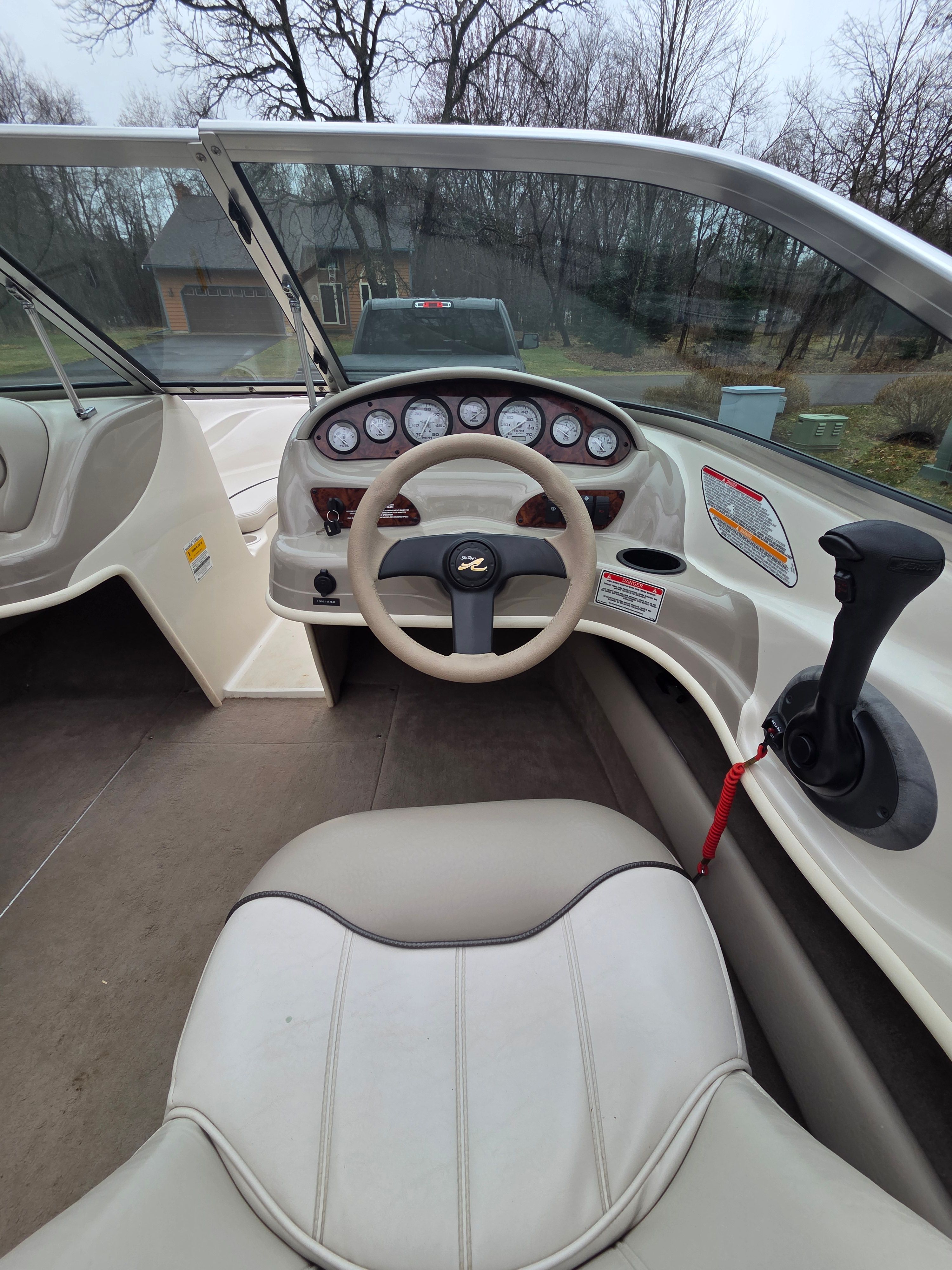 Interior view of a 2002 Sea Ray 182 boat cockpit.