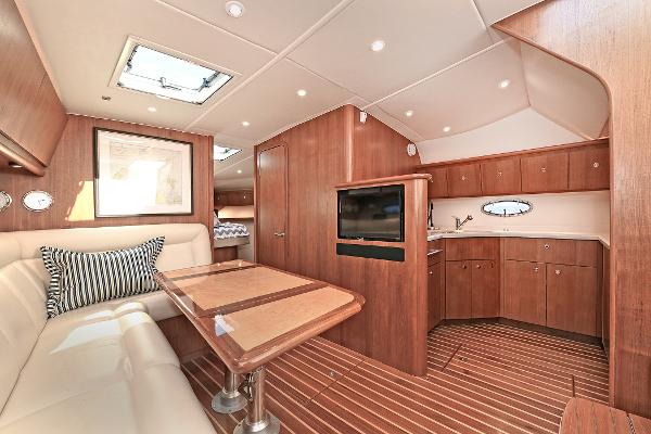 Luxurious interior of 2008 Tiara Yachts 4200 Open, featuring elegant wood finishes and modern amenities.
