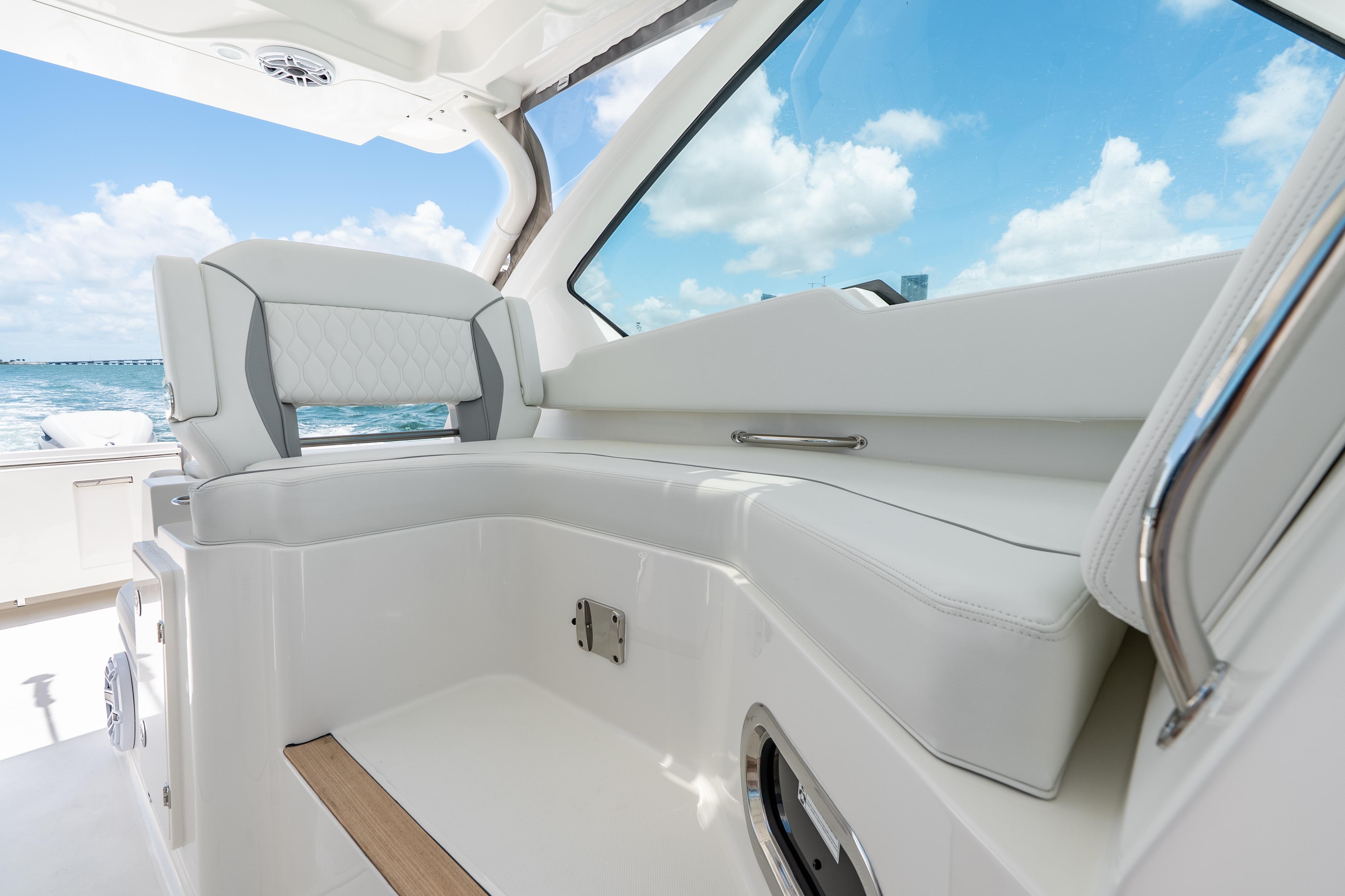 2026 Pursuit DC 326 Dual Console interior with luxurious seating and ocean view.
