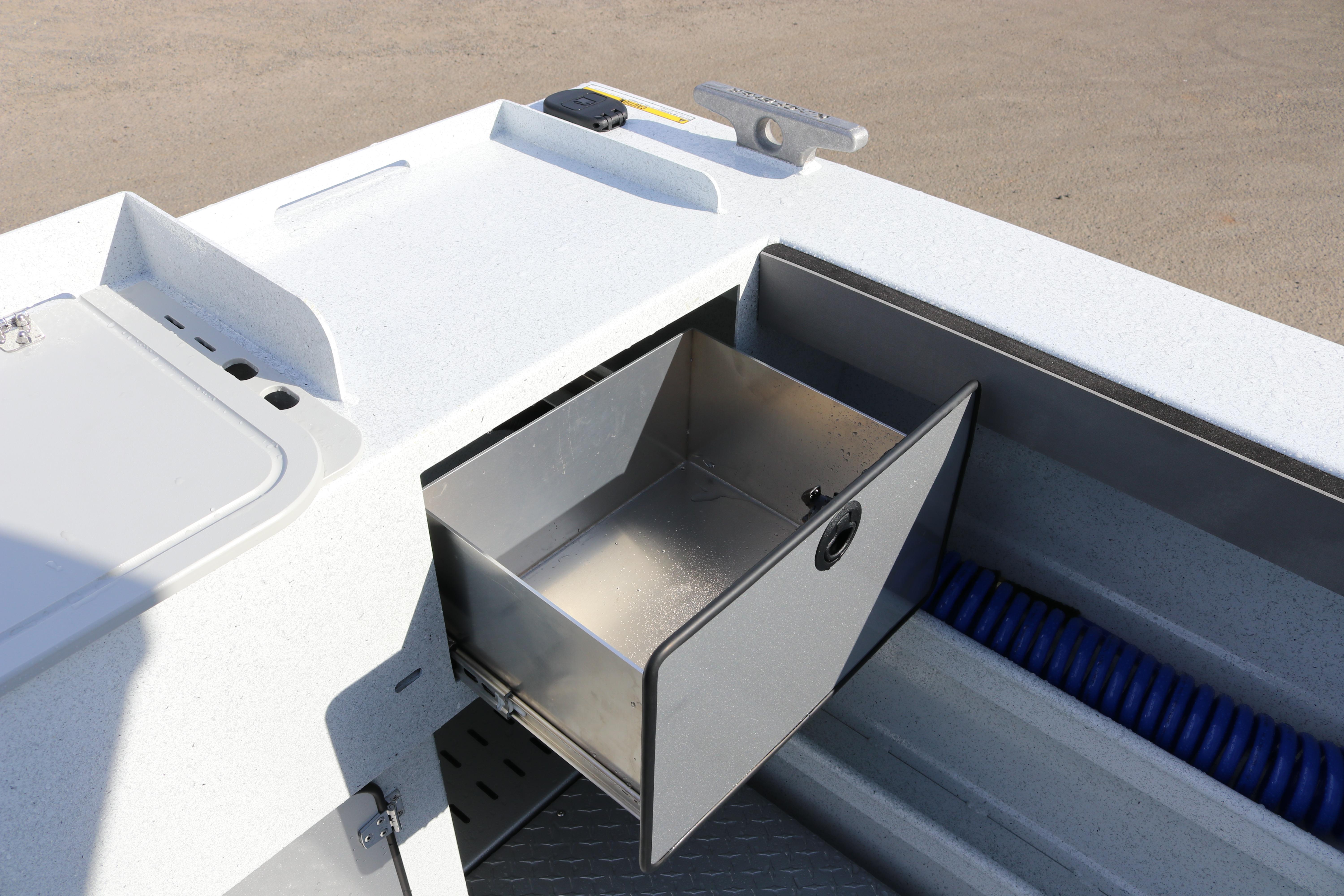 2026 KingFisher 2425 Escape HT boat storage compartment with open drawer and coiled hose.