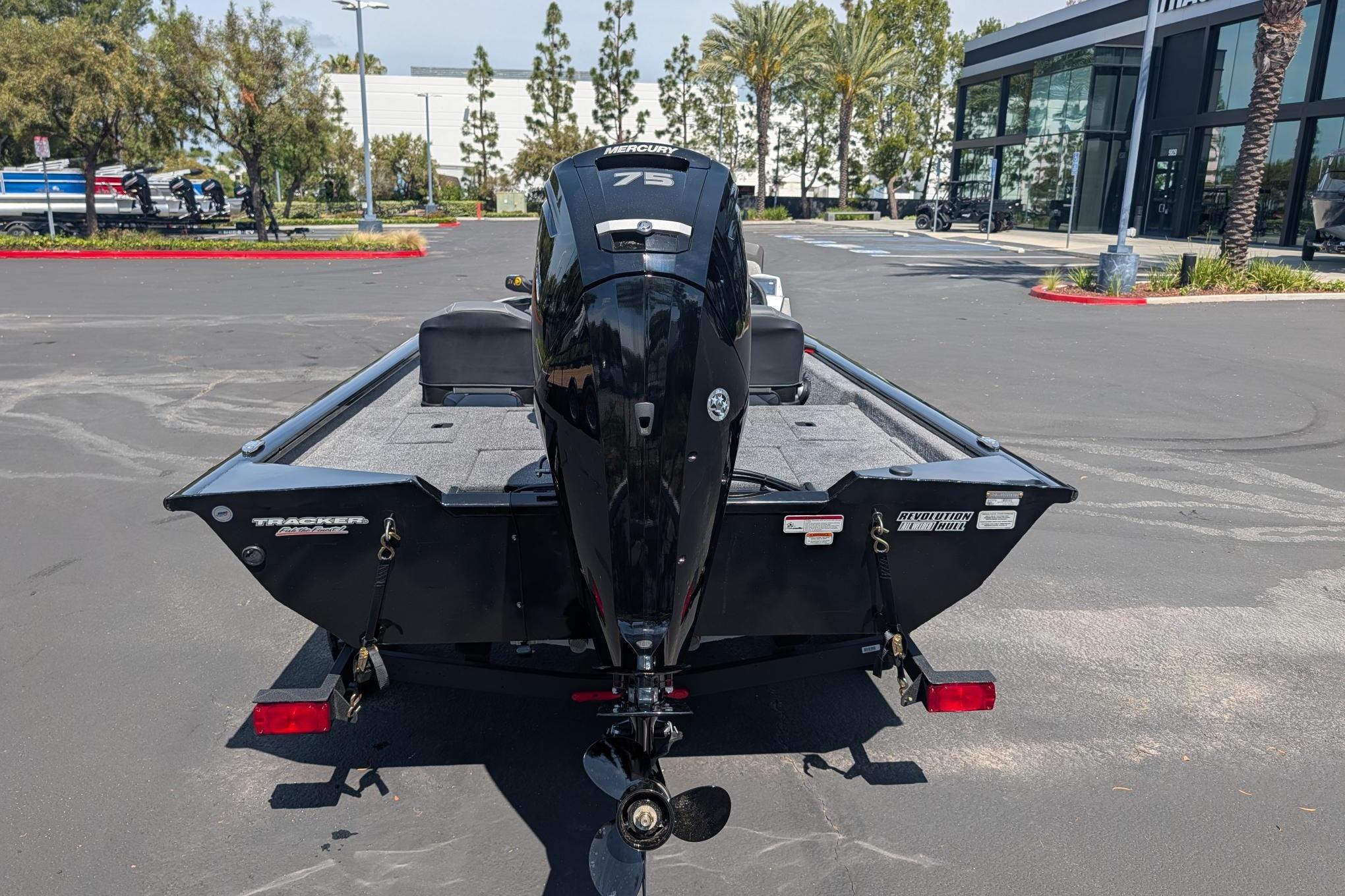The image shows a Tracker Pro Team 175 Crappie Edition boat on a trailer in a parking lot.