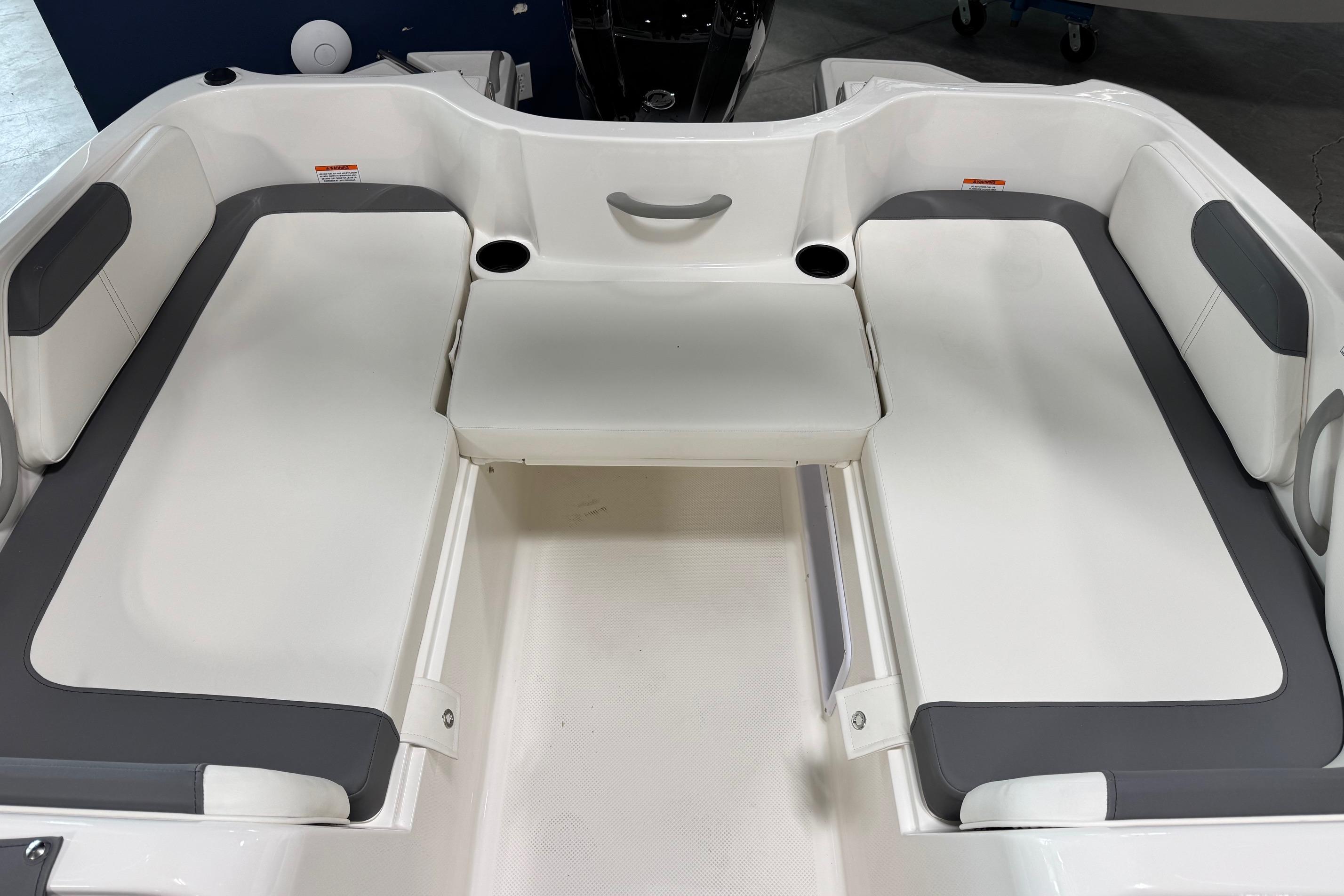 2026 Bayliner Element E18 boat interior with white and gray seating arrangement.