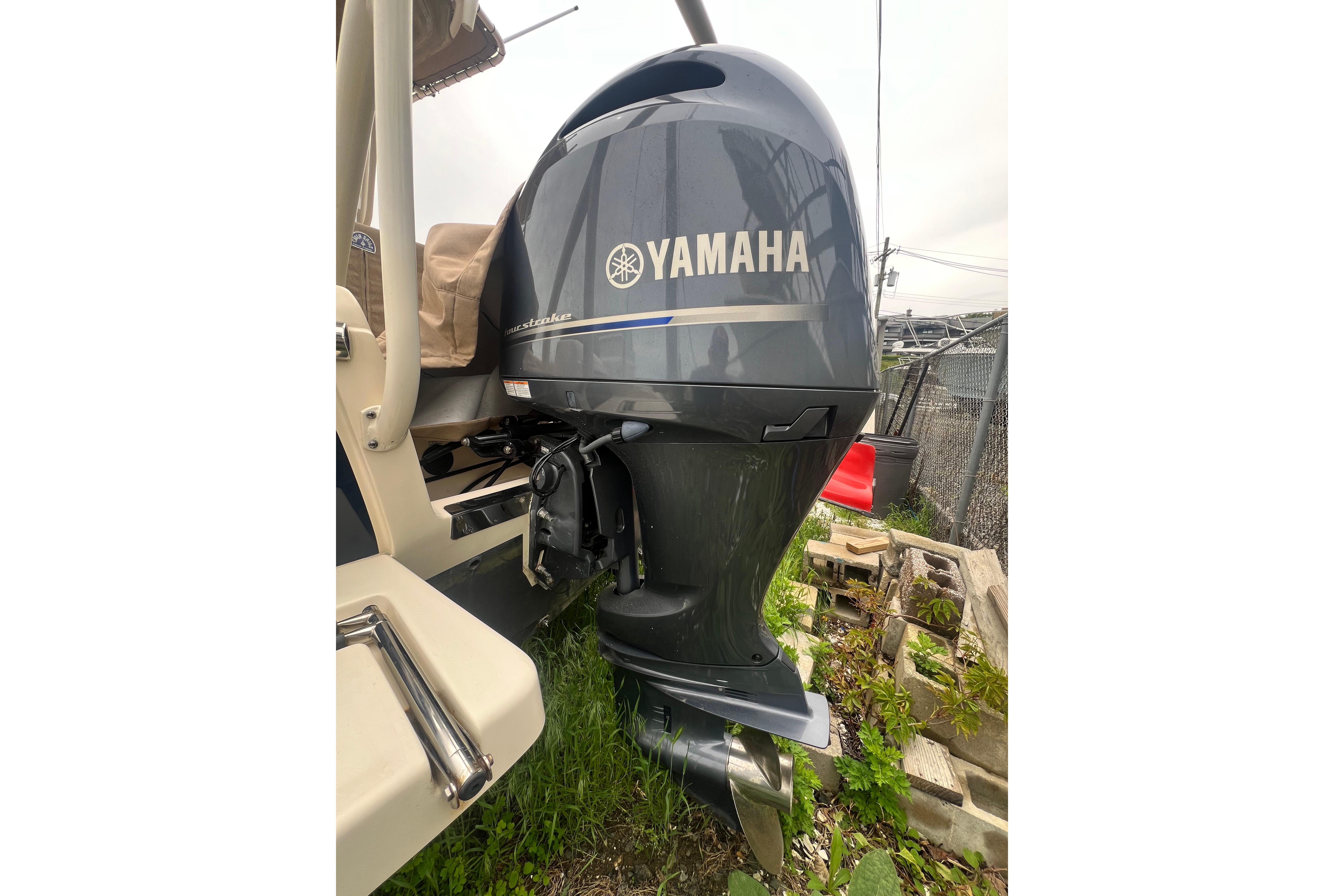 2020 Scout 195 Sportfish with Yamaha outboard motor, parked outdoors.
