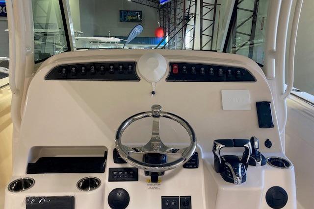 2026 Grady-White Canyon 336 helm with modern controls and steering wheel.