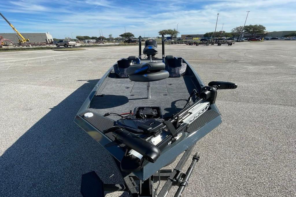 2026 Ranger RT198P fishing boat parked in a lot under a clear blue sky.