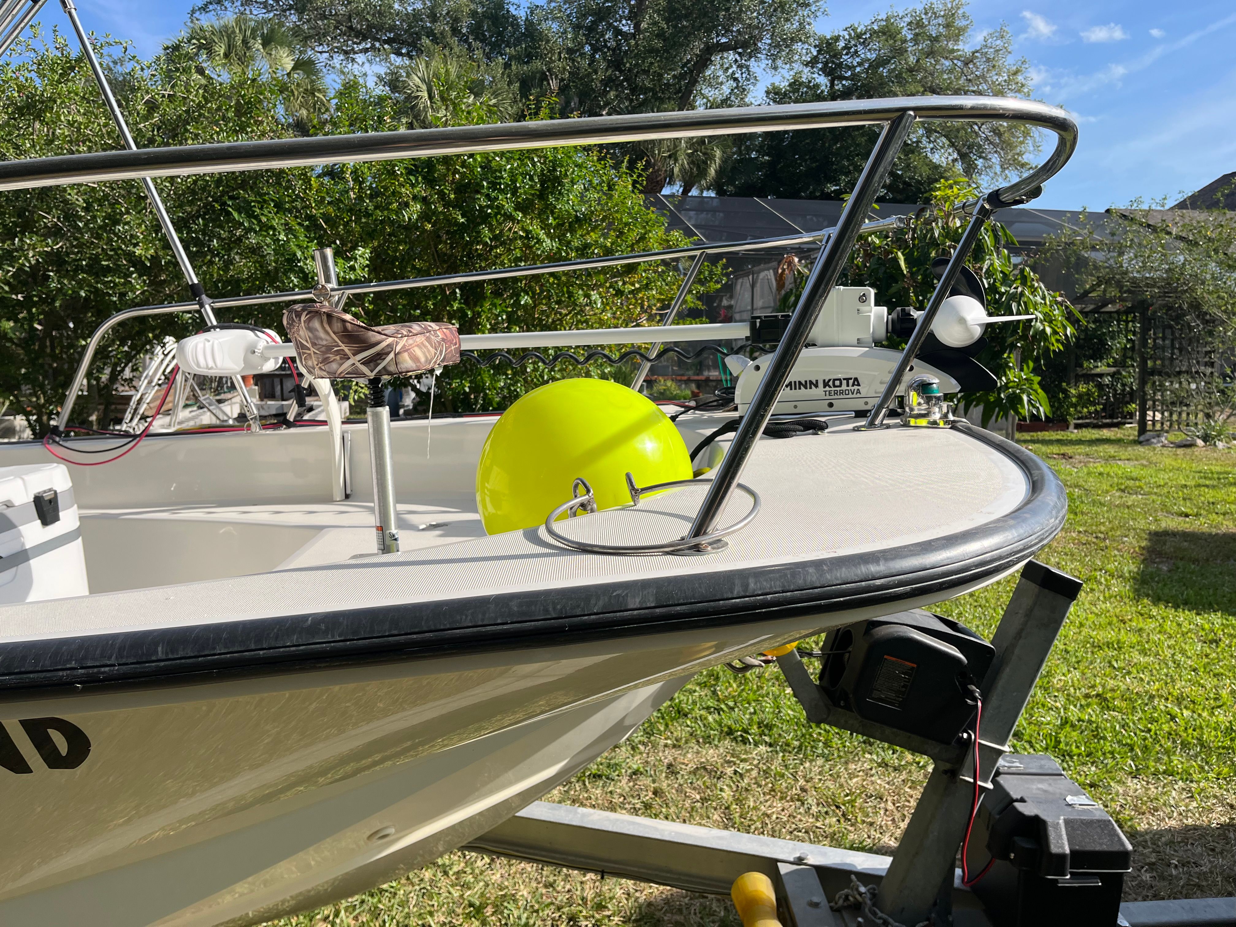 Boston Whaler 170 Montauk 2005 on trailer in garden.