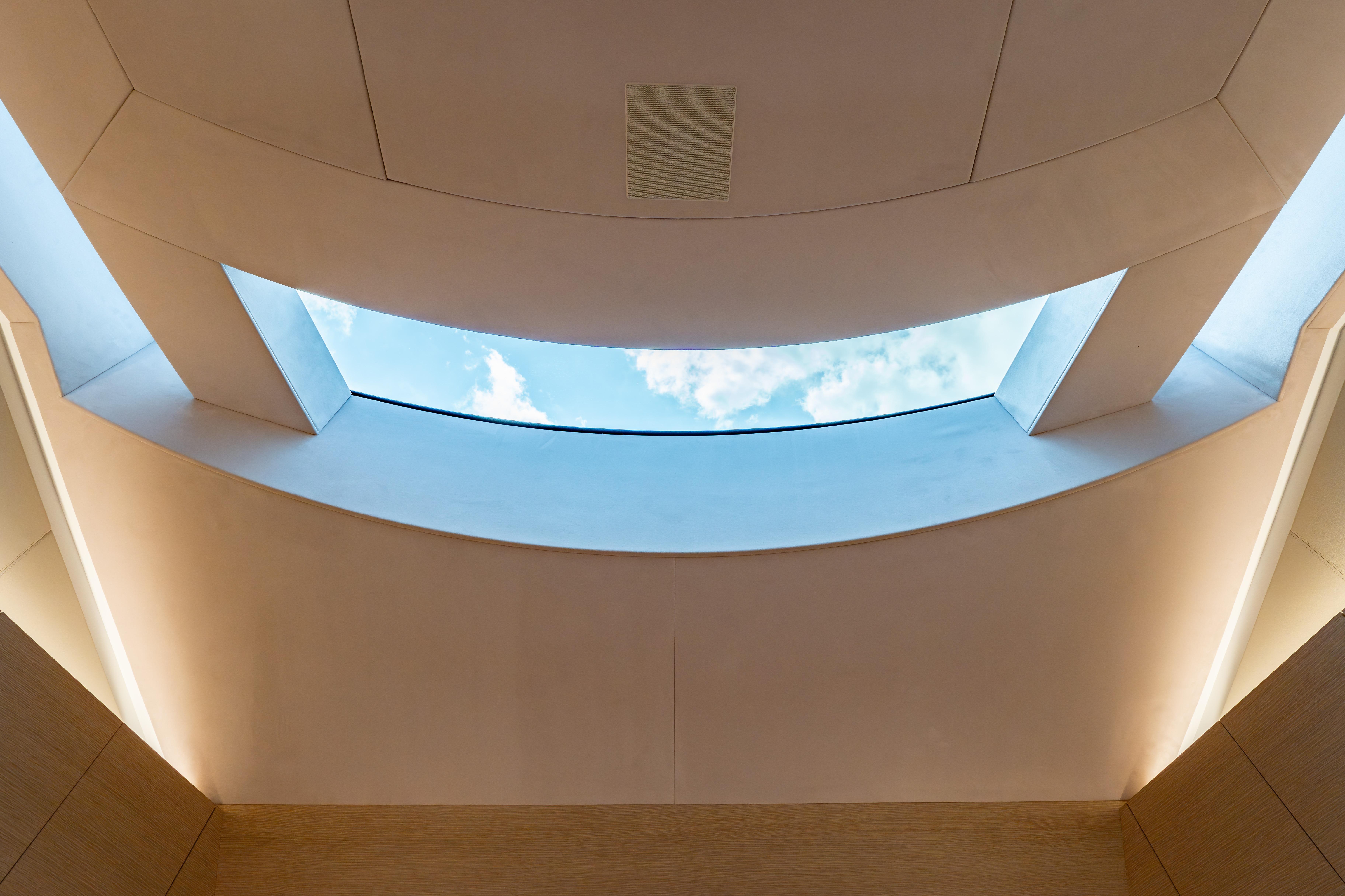 Interior view of Wajer 77 yacht skylight with blue sky and clouds.