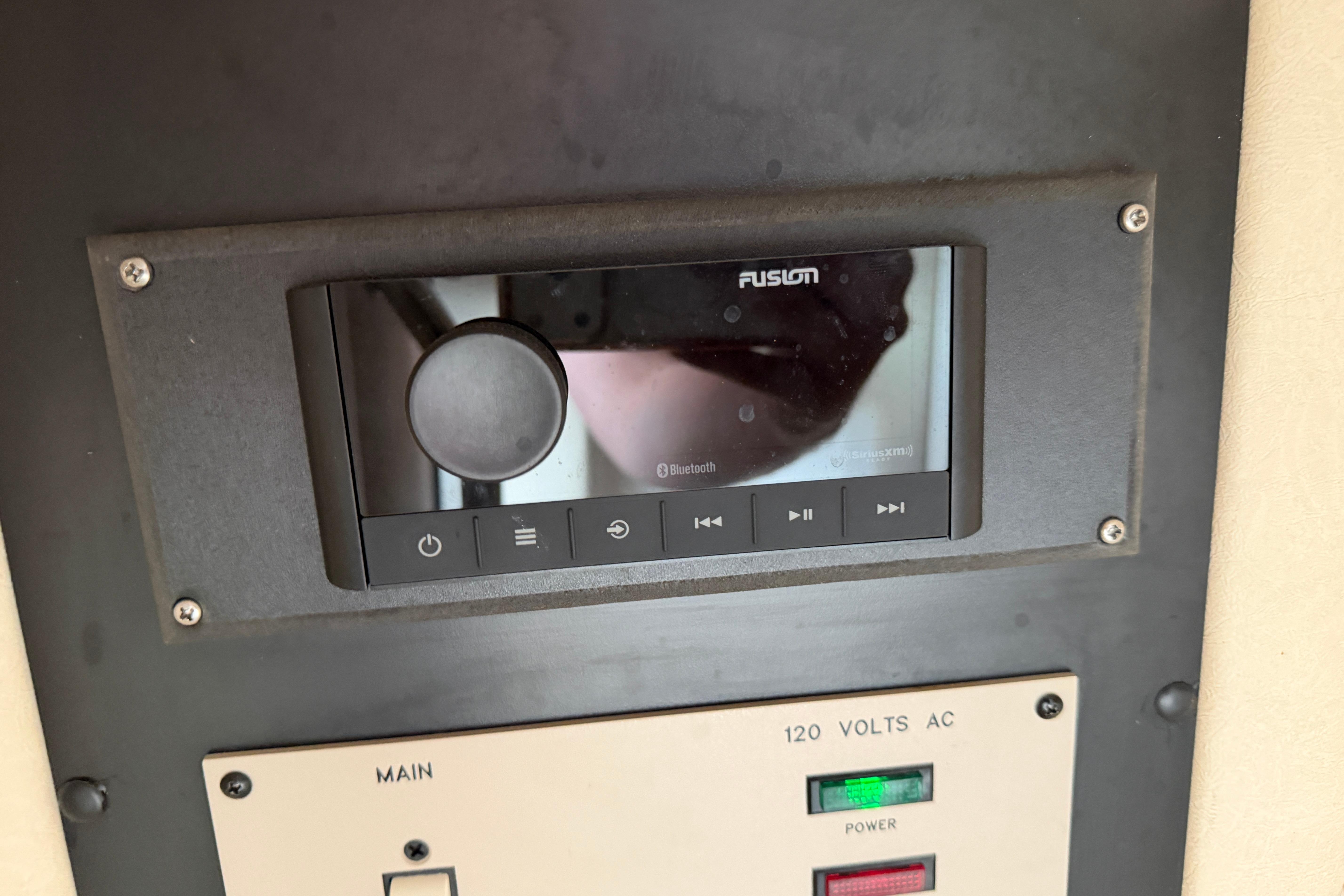Fusion audio system and control panel on a 2003 Sea Ray 290 Bowrider boat.