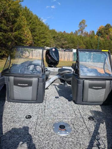 2025 Tracker Targa V-19 WT boat interior with dual consoles, forest backdrop.