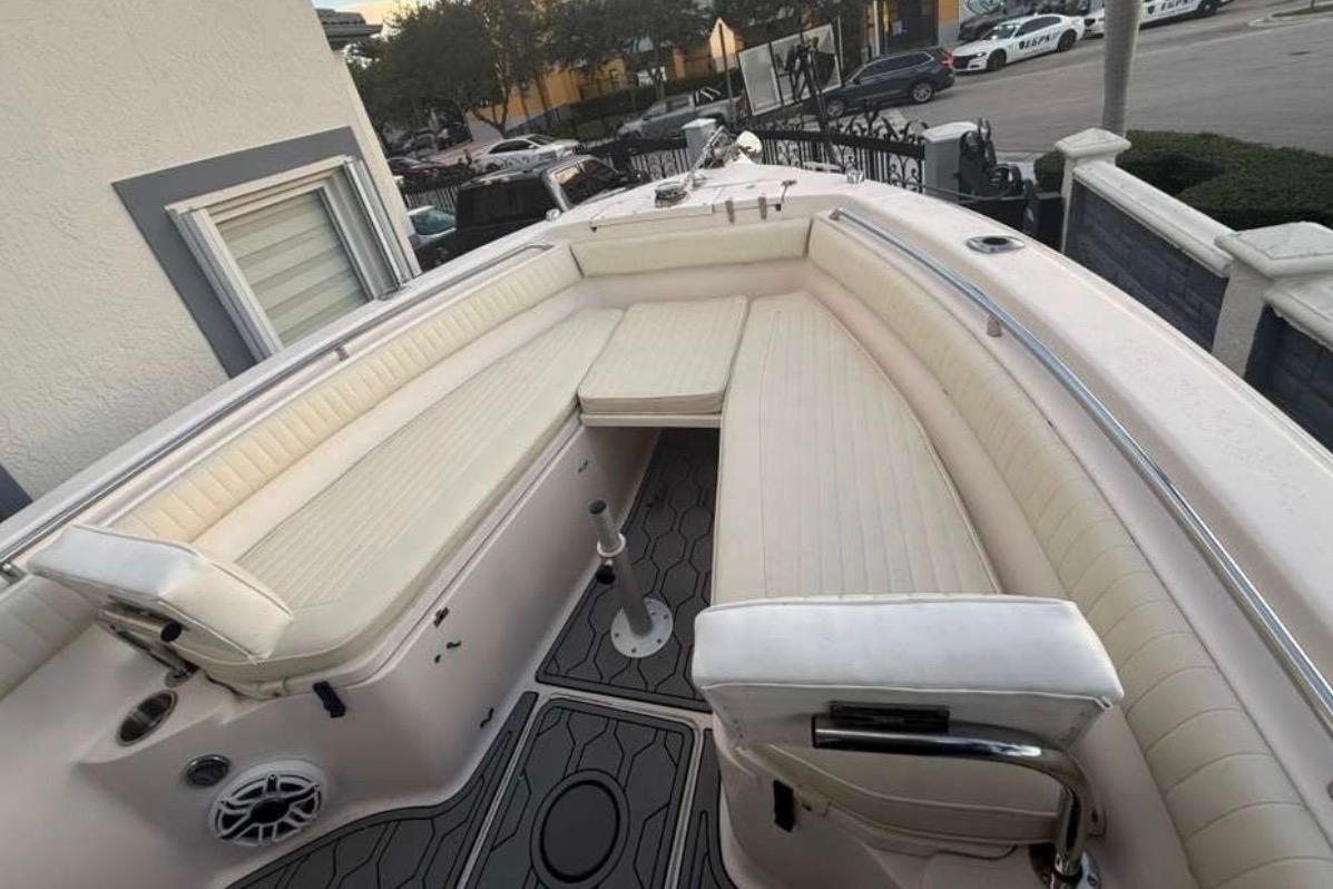 2004 Grady-White Chase 273 boat with spacious seating and modern design.