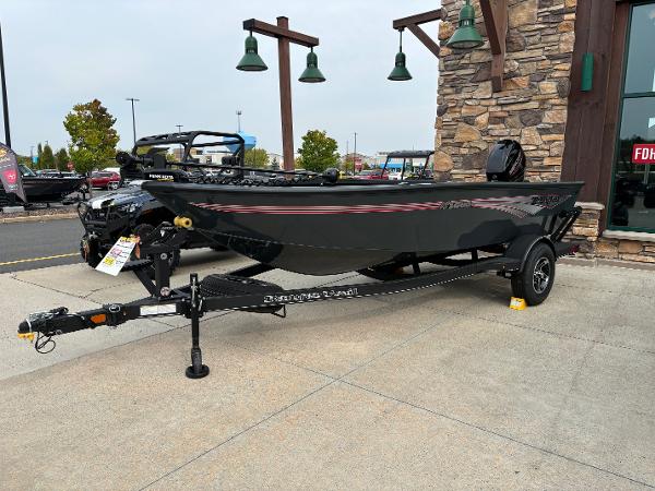 2024 Ranger VS1665T fishing boat on display outside a store.
