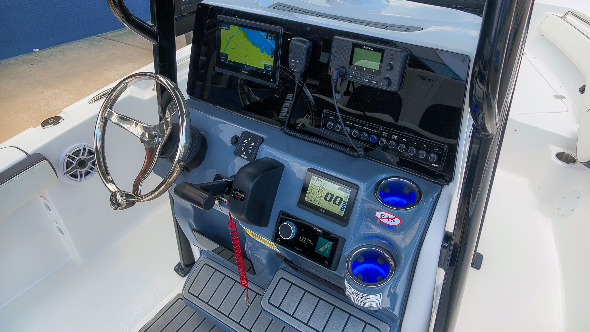 Dashboard of a Tidewater 198 CC Adventure boat with modern electronics and controls.