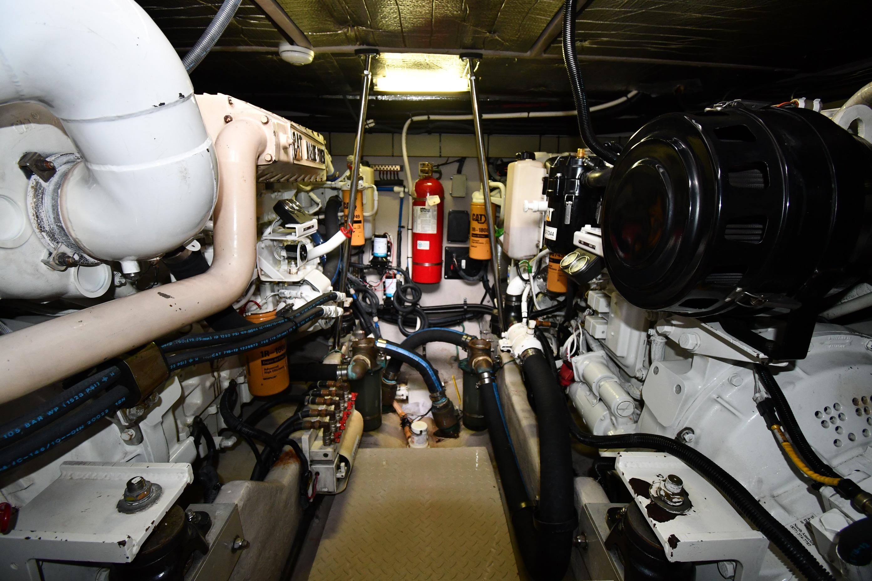 Engine room of 2001 Sea Ray 540 Sundancer yacht, showcasing mechanical components and systems.