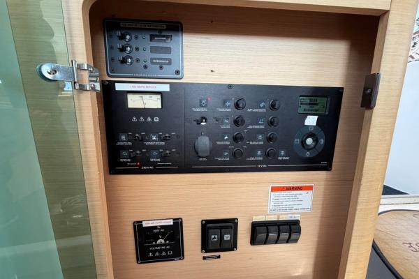 Control panel of a 2008 Lagoon 420 yacht, featuring various switches and dials.