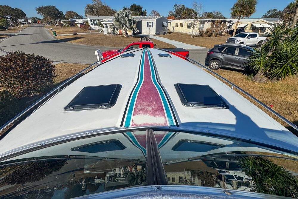 1989 Formula 292 SR-1 boat on trailer in residential neighborhood.