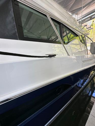 2019 Tiara Yachts C53 model docked in a marina.