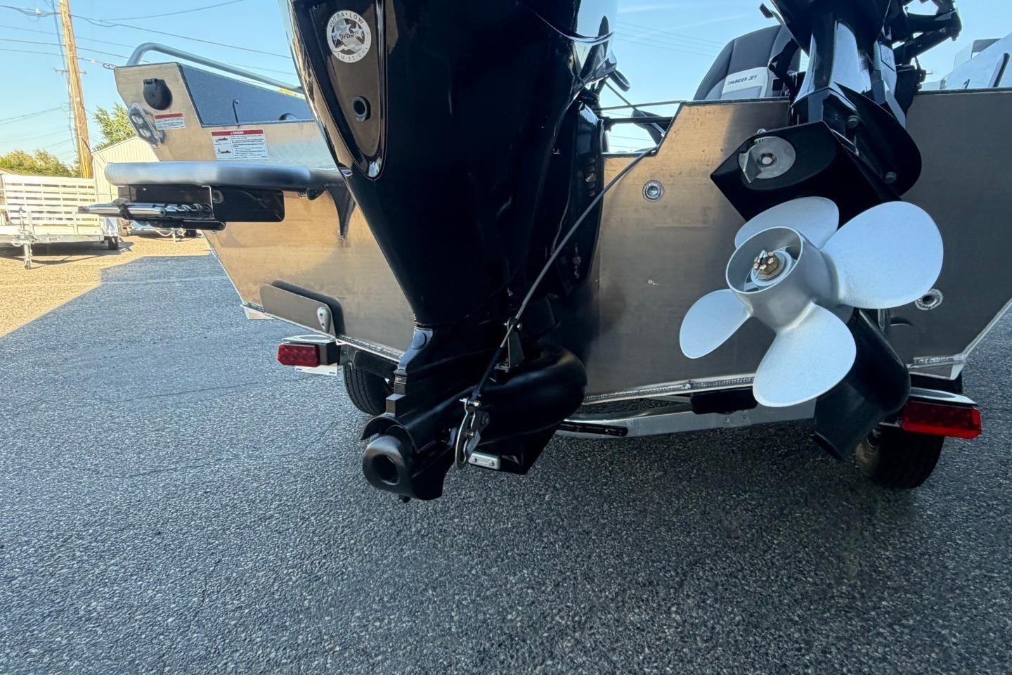 Rear view of 2026 Thunder Jet 209 Rush OT boat with visible propeller and motor.