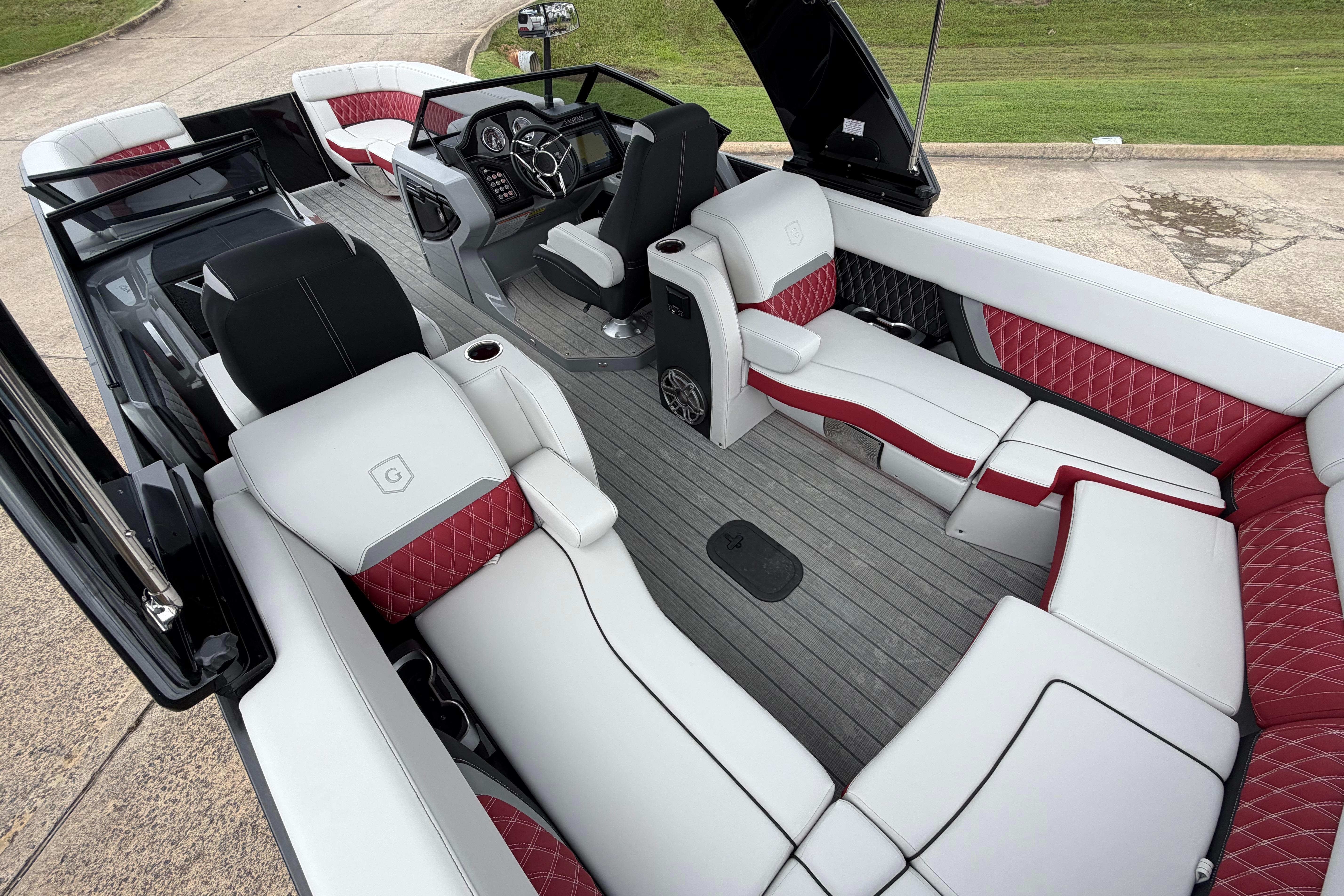 Luxurious interior of 2023 Godfrey Sanpan 2700 ULW Twin pontoon boat with stylish seating.