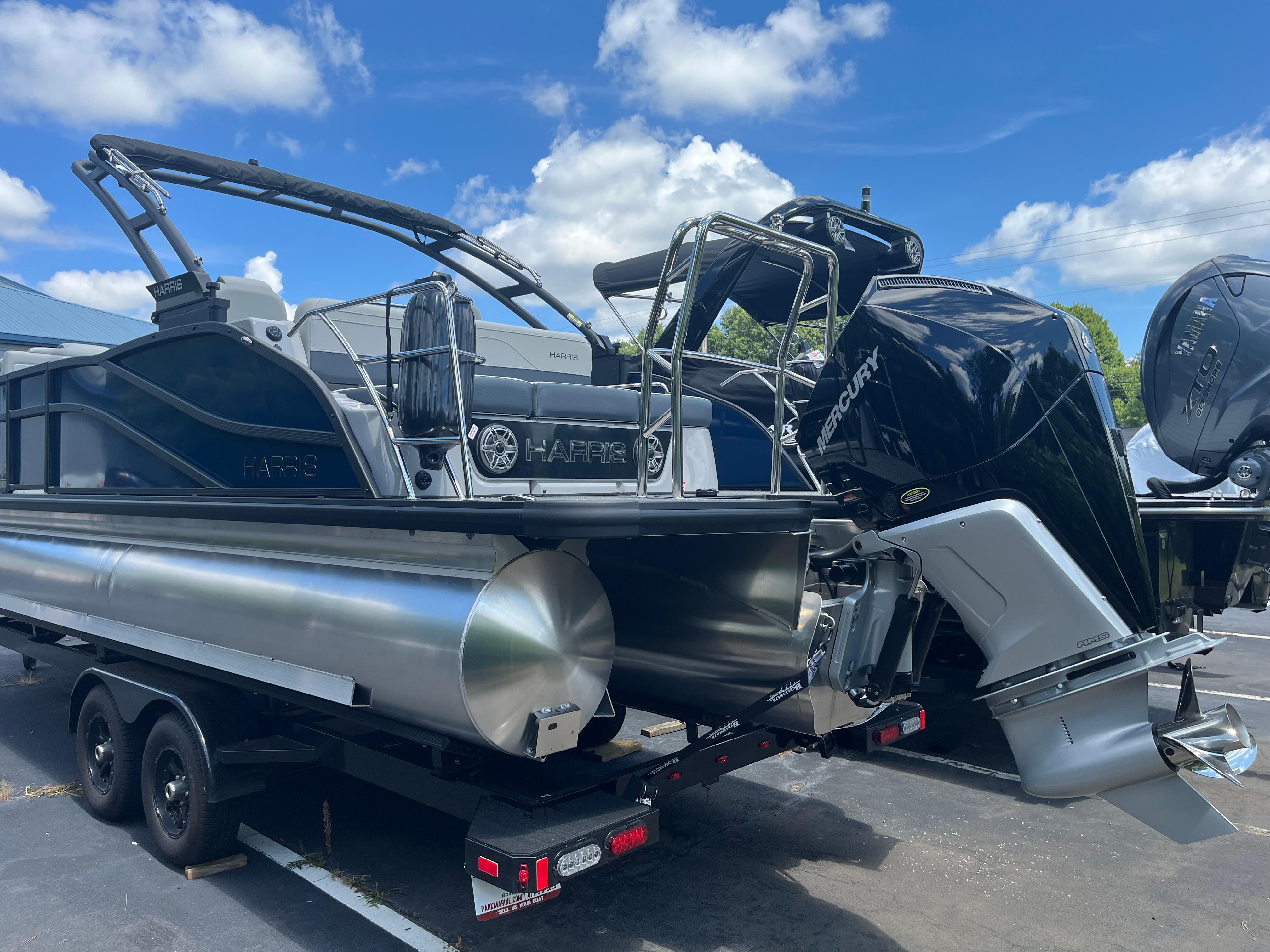 2026 Harris Grand Mariner 230 pontoon boat with Mercury outboard motor on trailer.