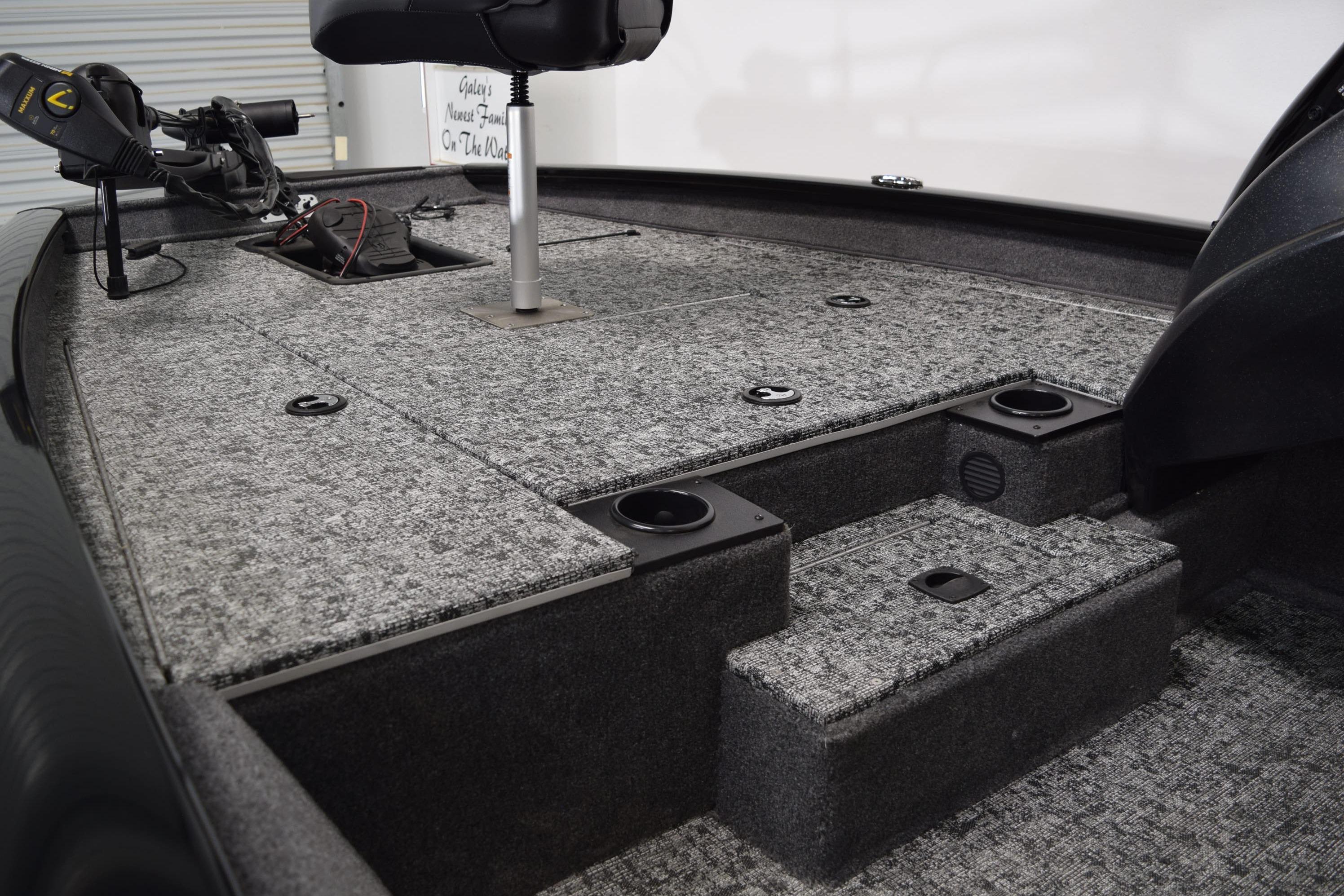 2026 Tracker Pro Team 175 boat interior with carpeted deck and seating.