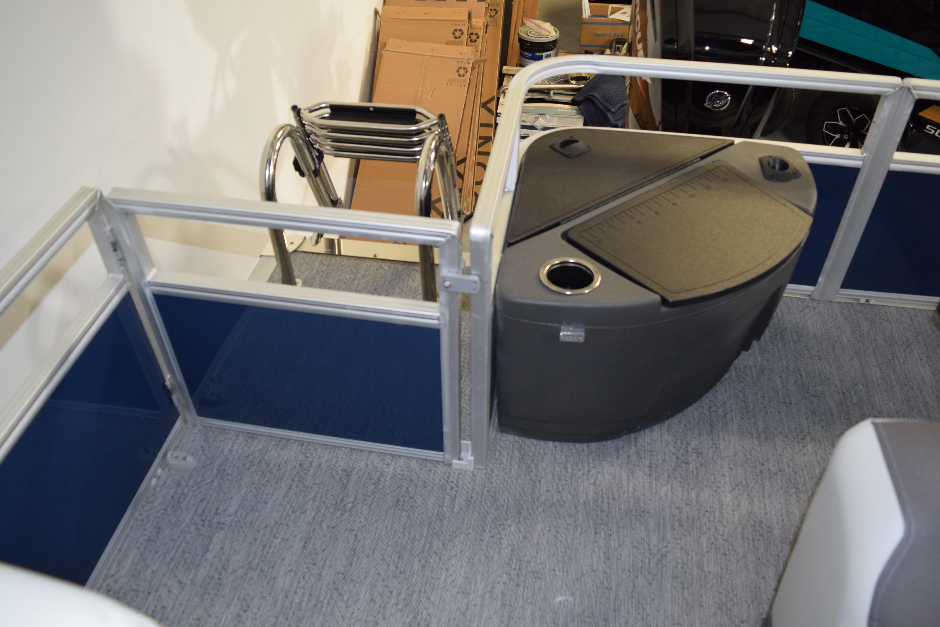 2026 Sun Tracker Bass Buggy 18 DLX interior with storage and seating area.