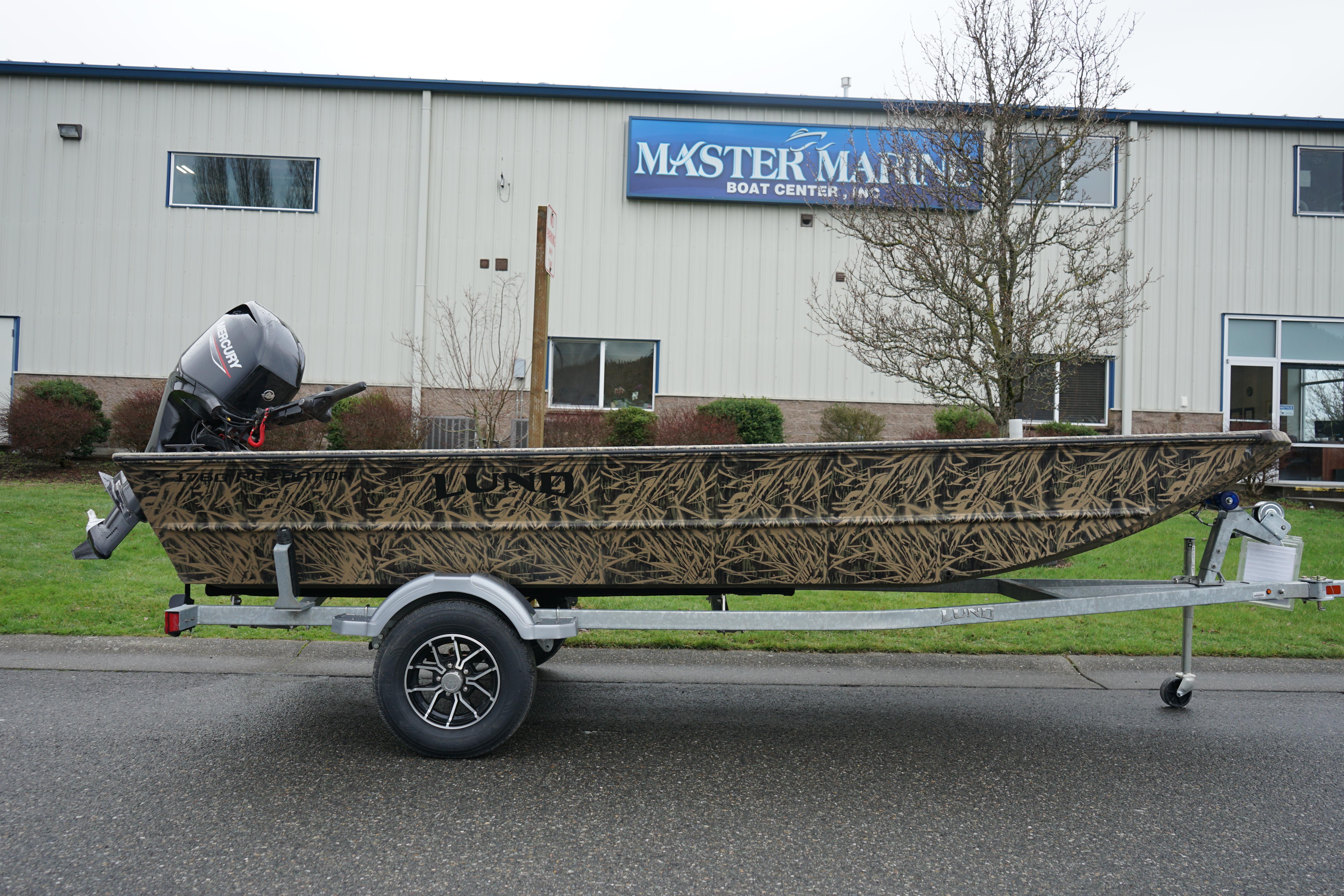 2024 Lund 1760 Predator Tiller boat on trailer outside Master Marine building.