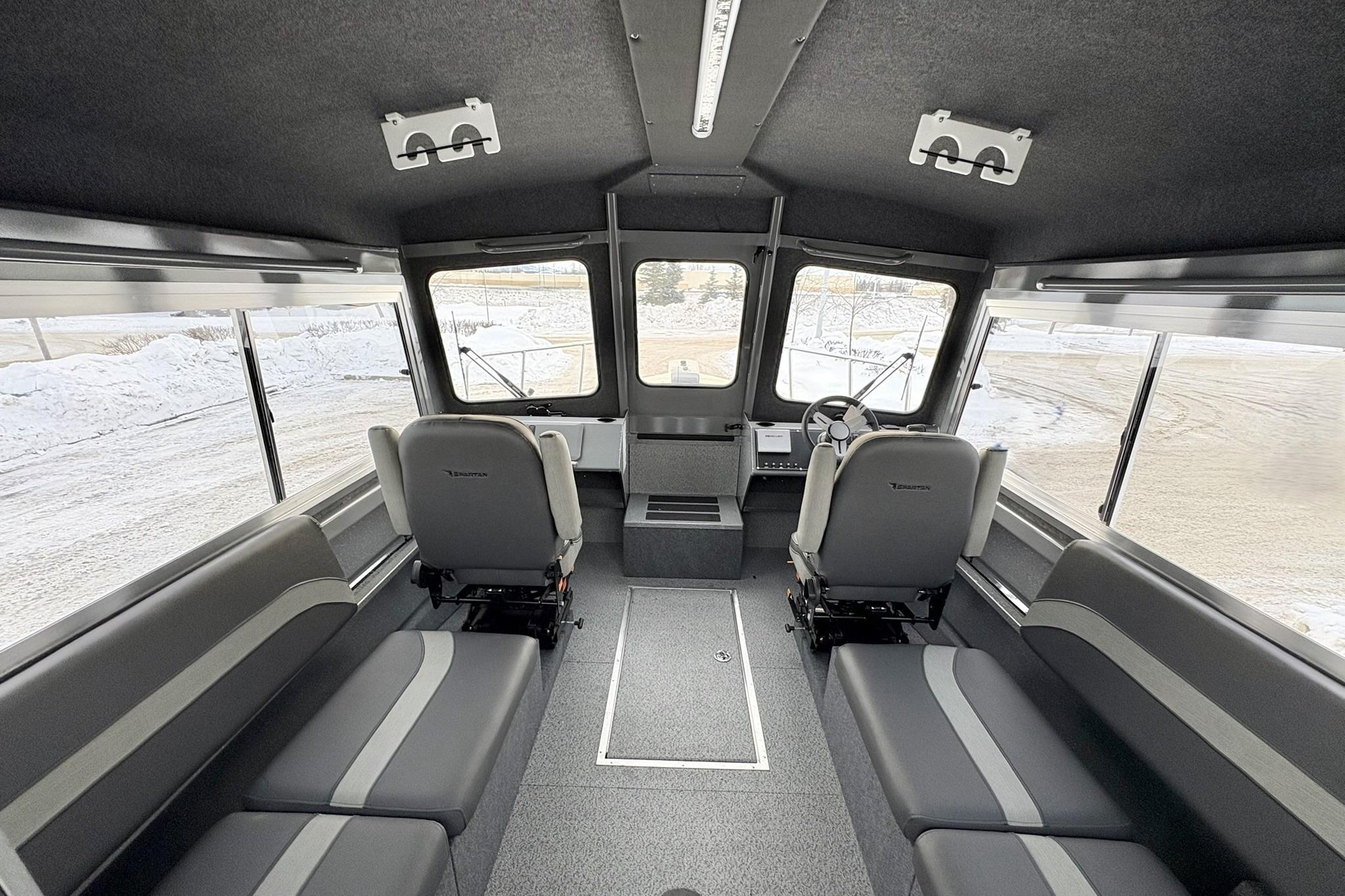 Interior of 2024 Spartan 26 Maximus Pro XL boat, featuring spacious seating and modern design.