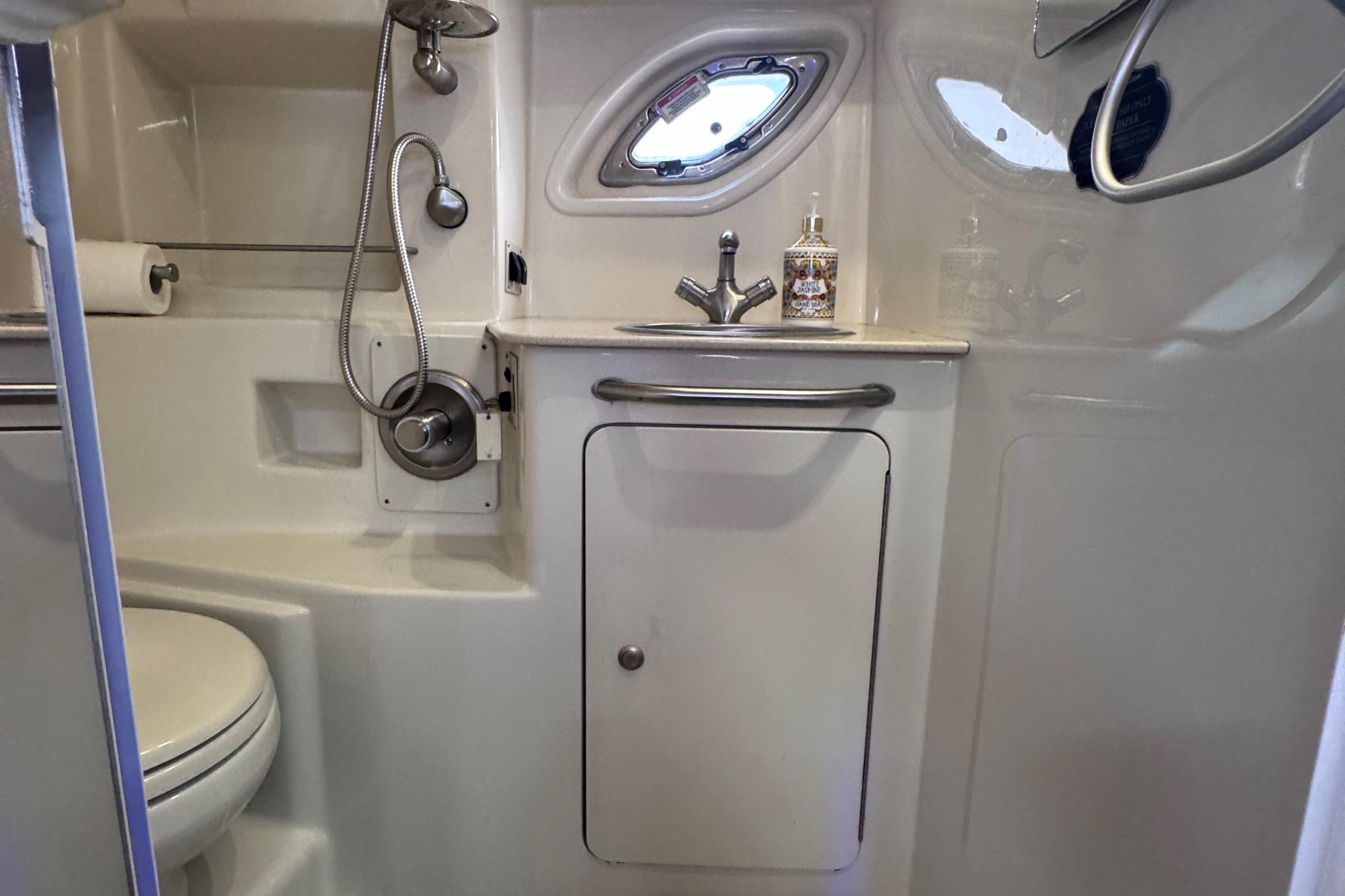 Bathroom interior of 2008 Sea Ray 350 Sundancer yacht, featuring sink and shower.