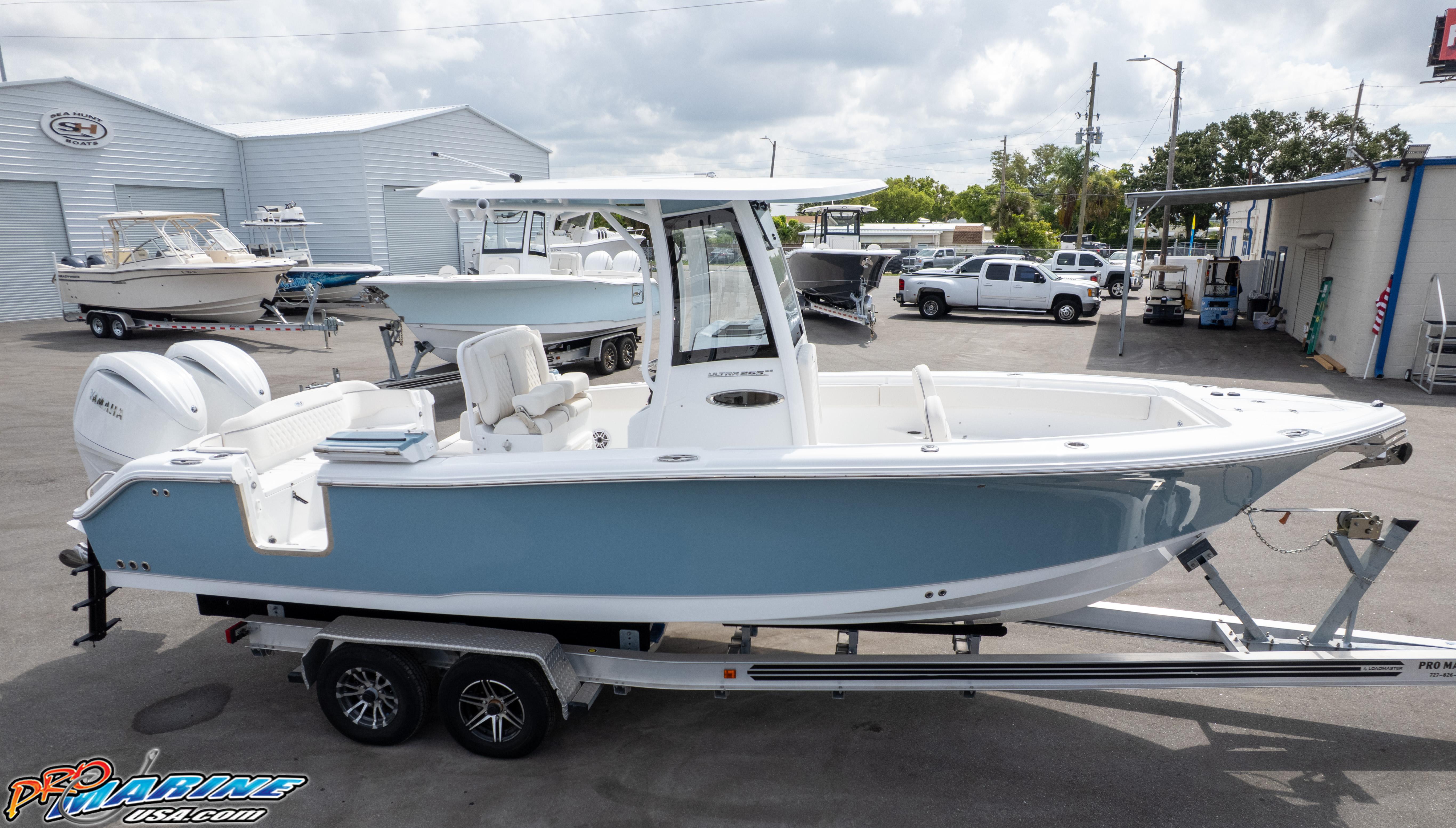 2026 Sea Hunt Ultra 265 SE boat on trailer at dealership.