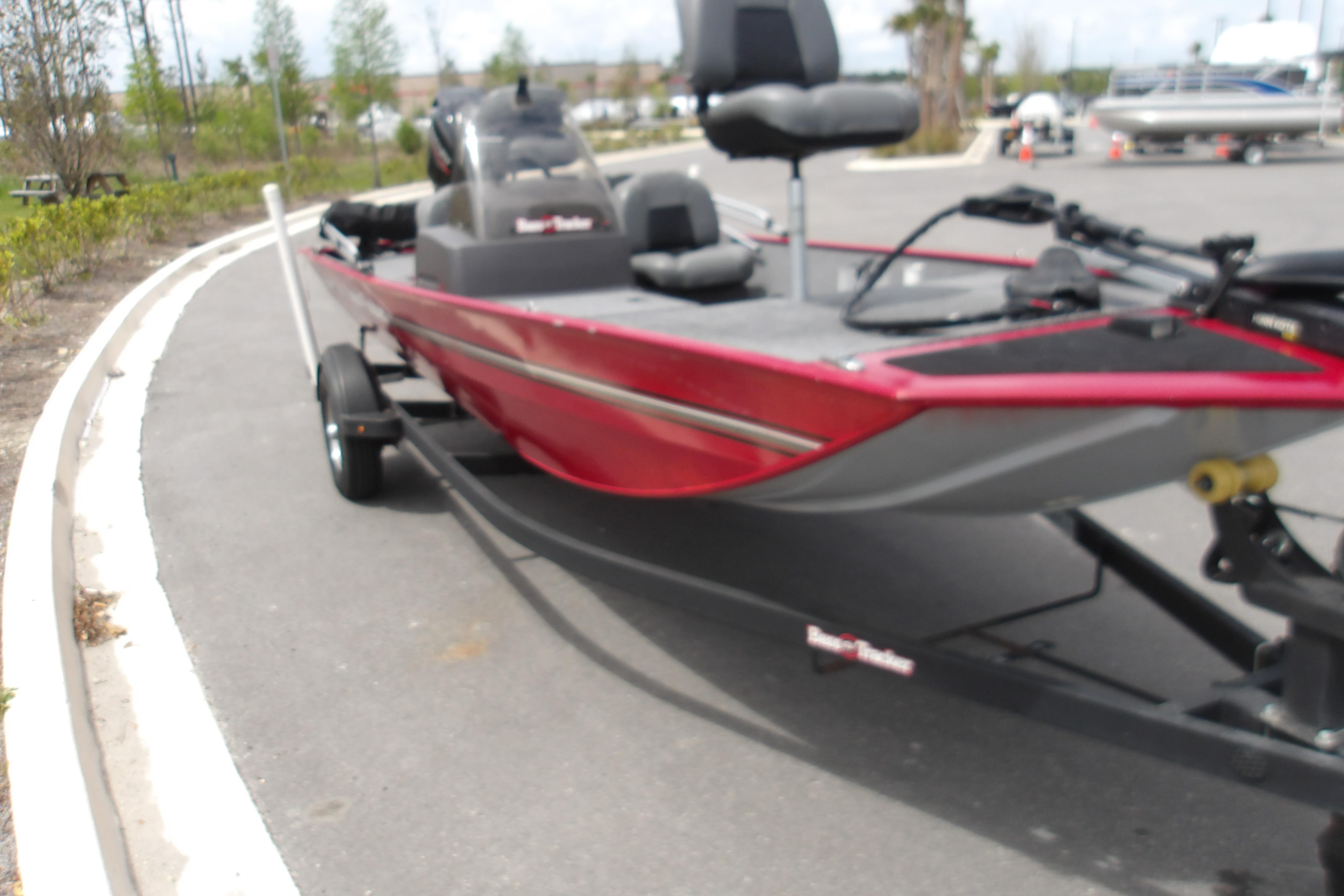 2024 Tracker Bass Tracker Classic XL boat on trailer, parked outdoors.