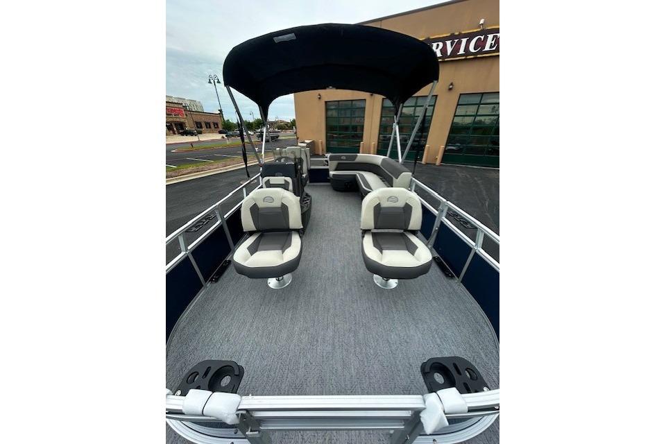 2026 Sun Tracker Bass Buggy 18 DLX pontoon boat with spacious seating and canopy.