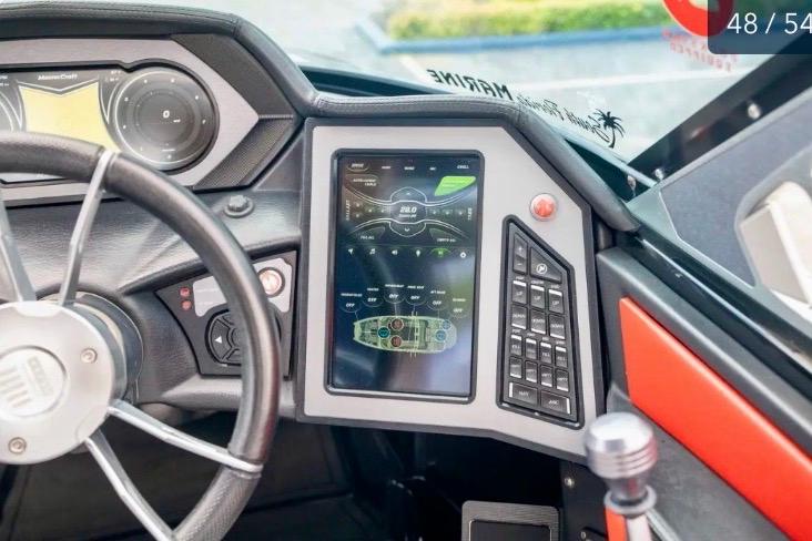 2019 MasterCraft XStar dashboard with touchscreen controls and steering wheel.