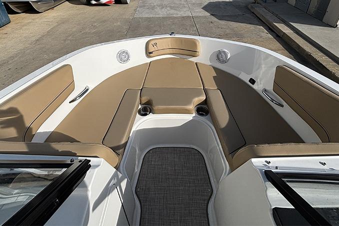 2023 Bayliner VR5 Bowrider OB interior with tan seating and spacious layout.