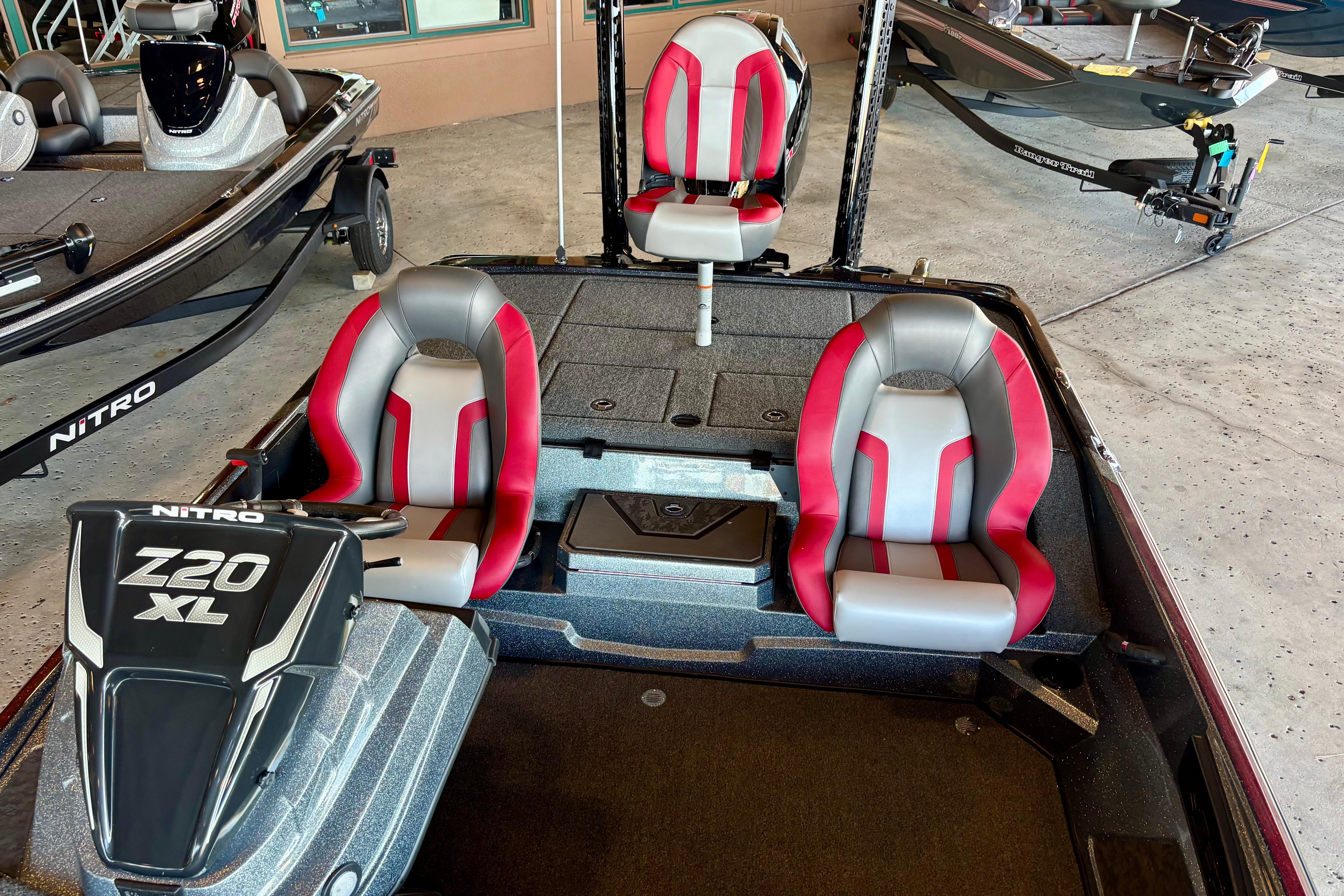 2026 Nitro Z20 XL Pro boat interior with red and gray seating, showcasing modern design.