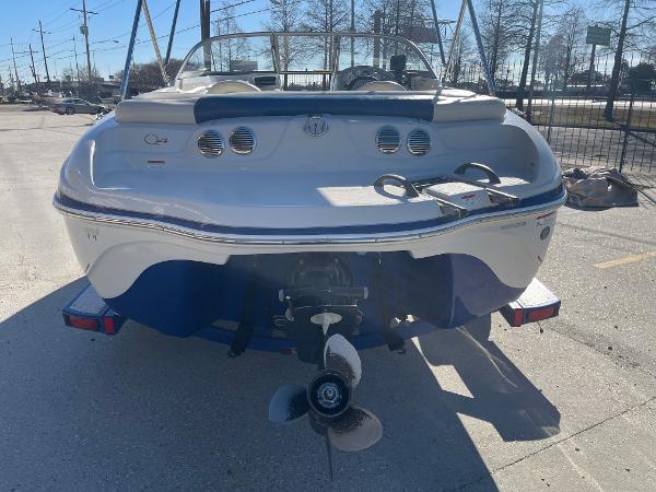 2012 Tahoe Q4 SS boat, rear view, parked on a sunny day.