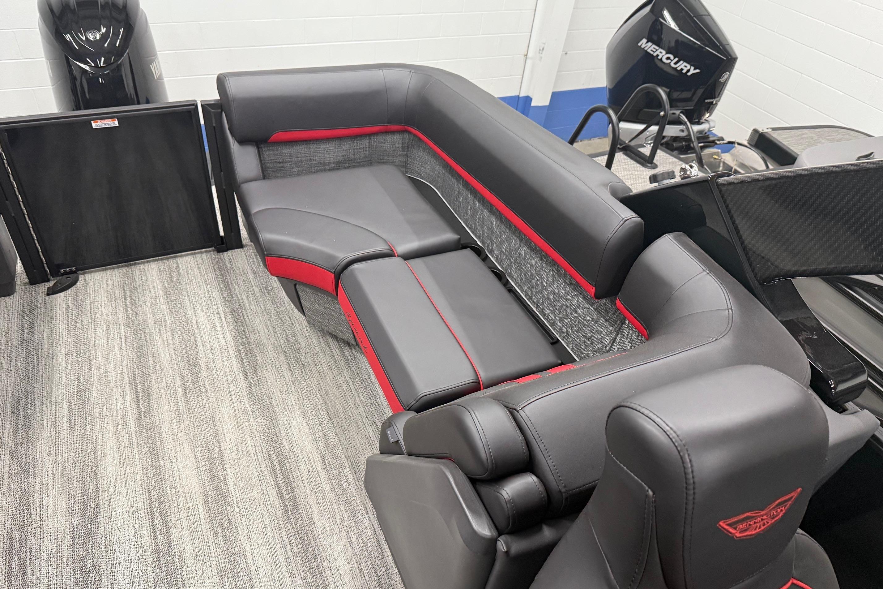 2025 Bennington M Line boat interior with sleek gray and red seating.