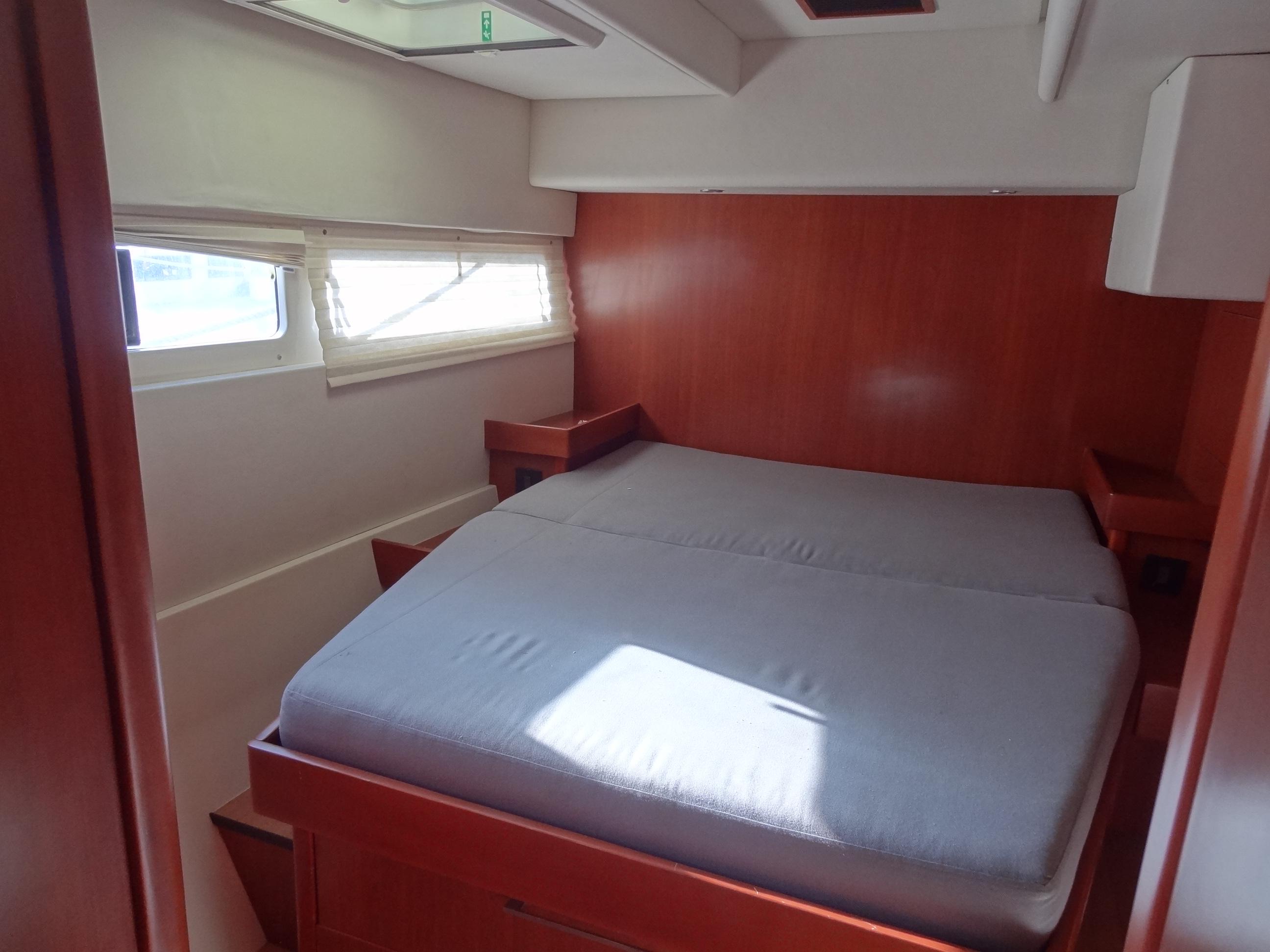 Leopard 58 2014 yacht interior cabin with double bed and wooden finish.