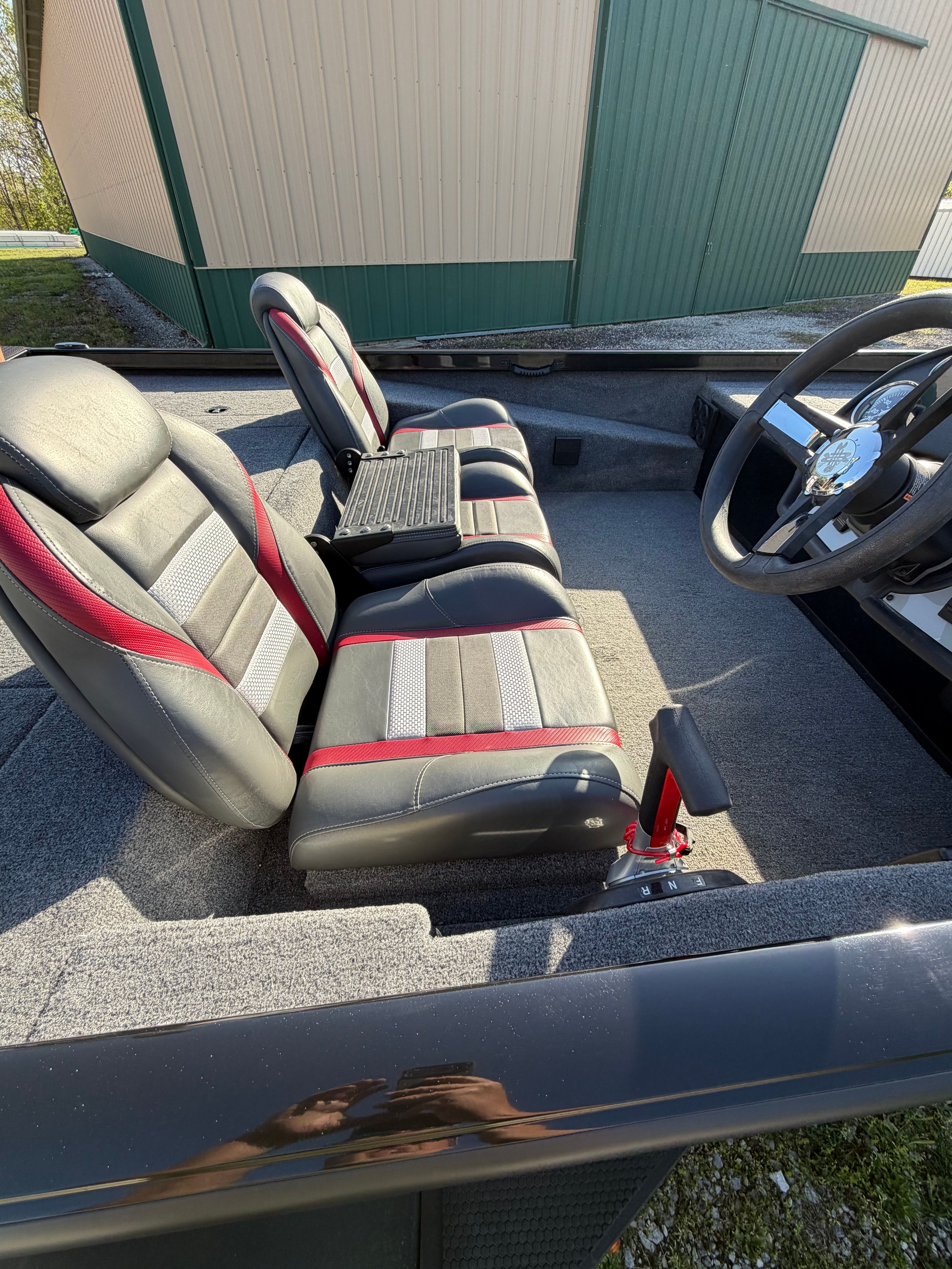 Interior of 2024 Ranger RT188 with gray and red seats.