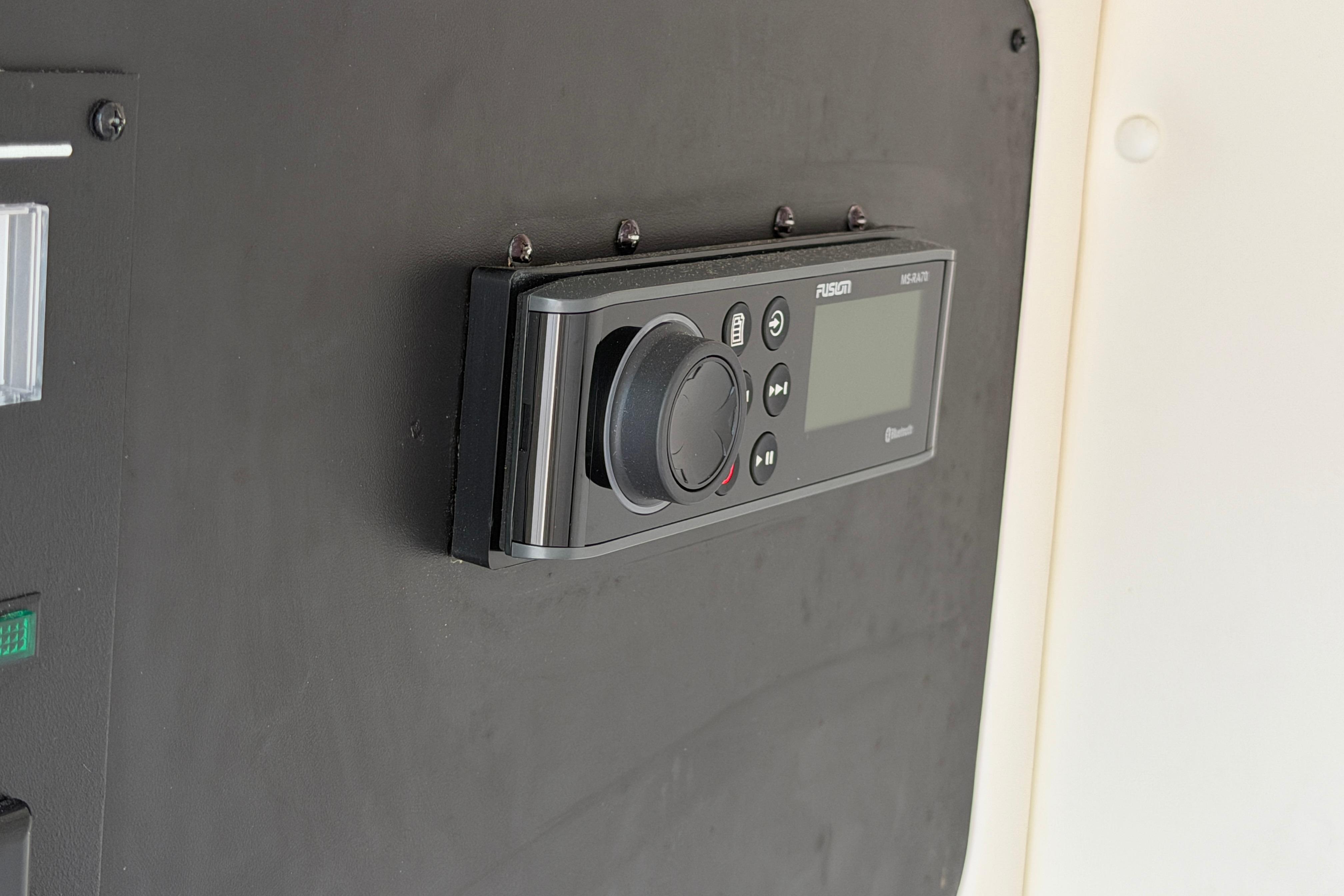 Fusion marine stereo system on 2013 Sea Ray 300 SLX boat dashboard.
