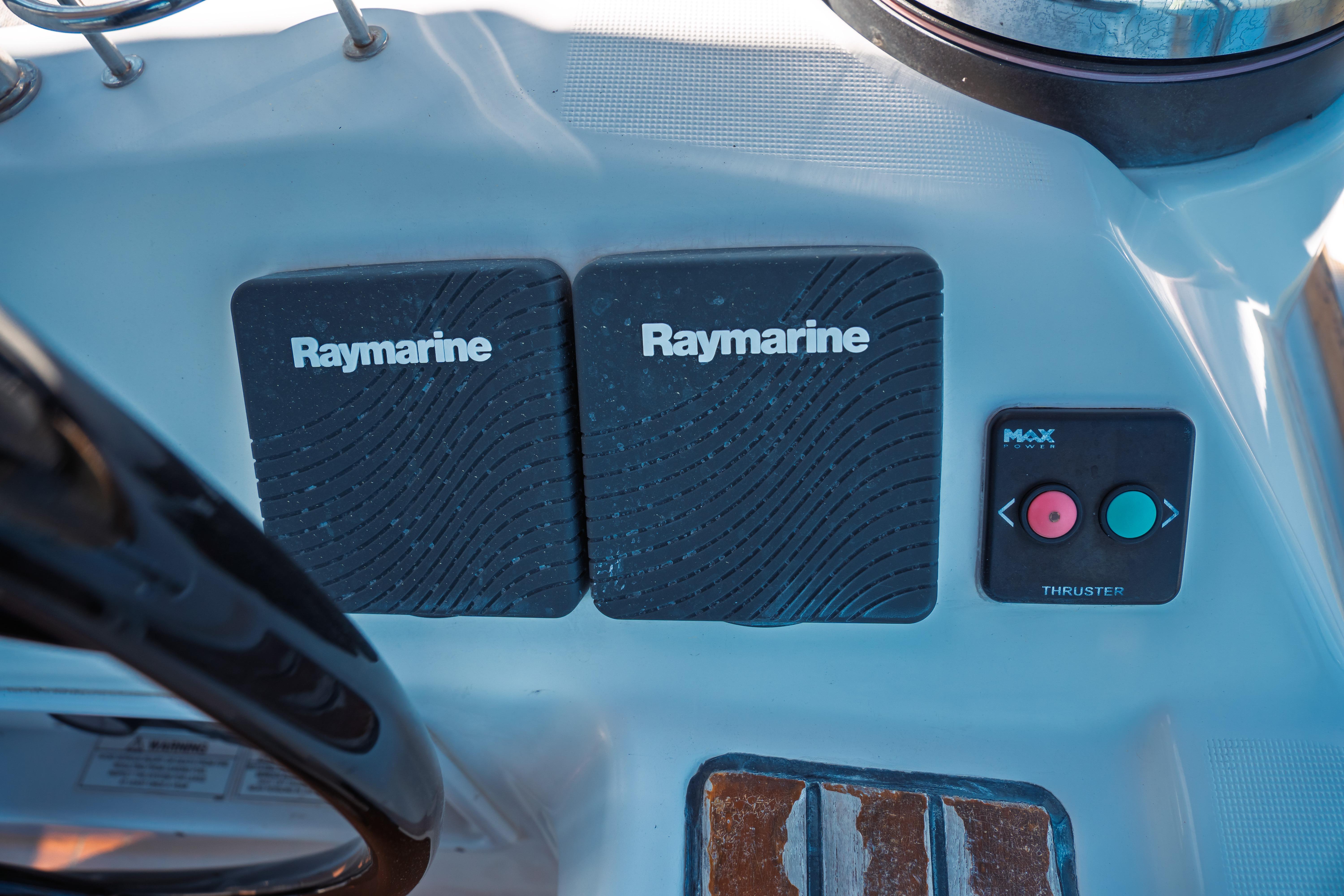 Control panel of 2011 Beneteau Oceanis 50 with Raymarine equipment and thruster buttons.