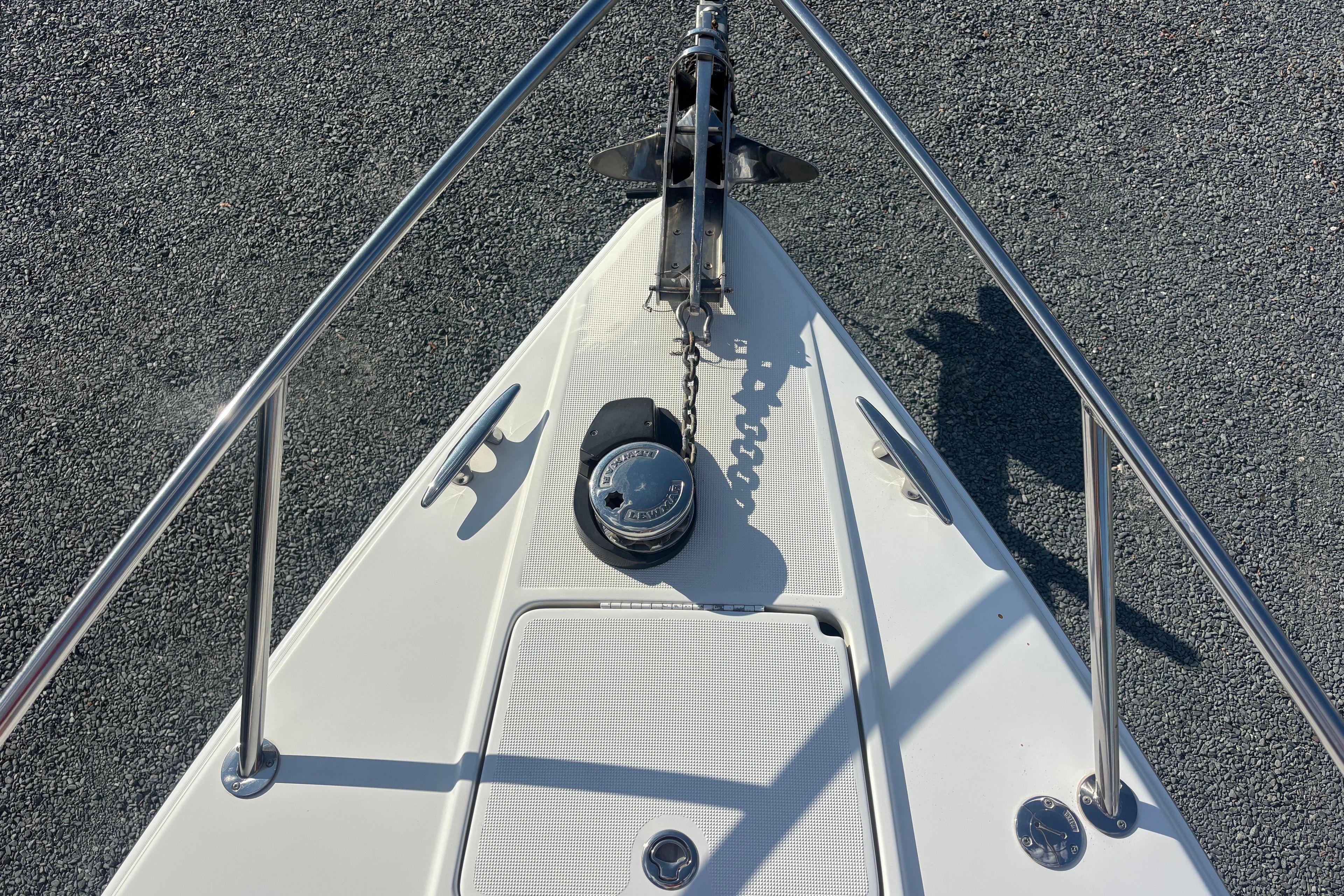 Bow of 2005 Formula 330 Sun Sport boat with anchor and chain mechanism.