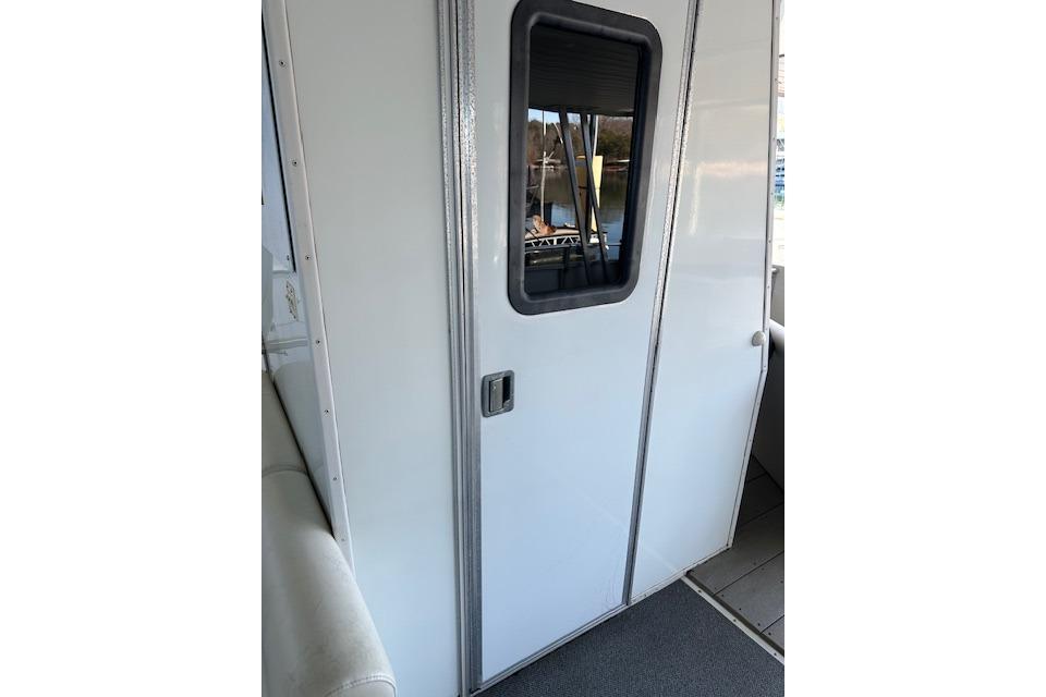 White door with window on 2008 Destination Yachts 45X14 boat interior.