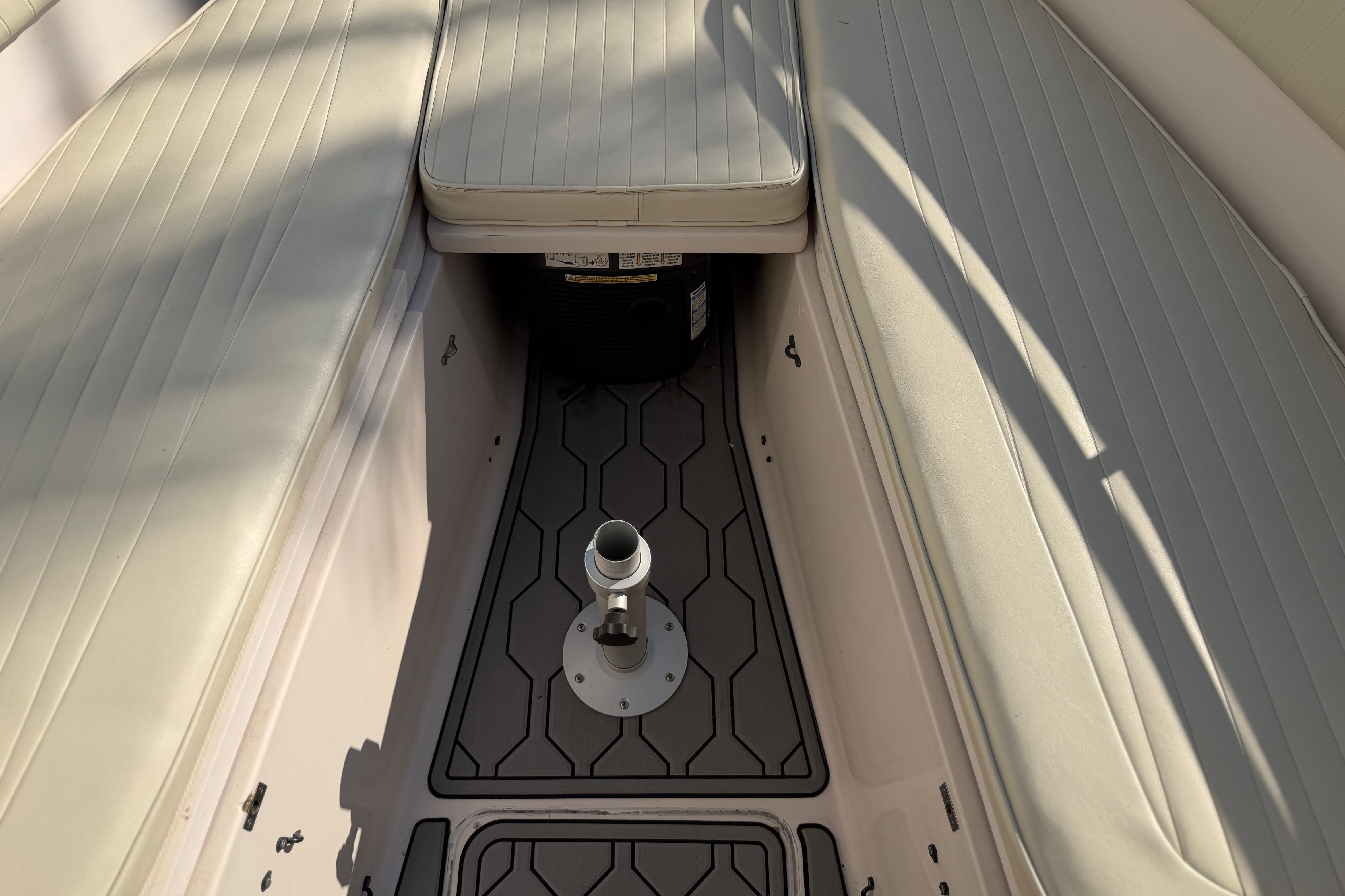 2004 Grady White 273 boat interior with cushioned seating and deck fittings.
