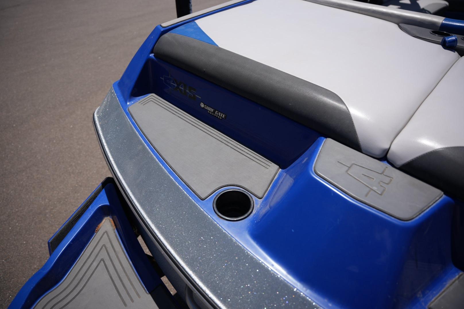 2015 Axis A24 boat rear deck with blue and gray detailing.